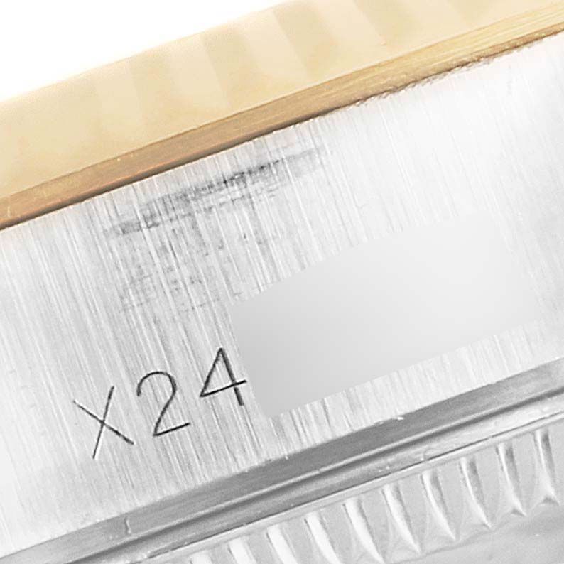 The image shows a close-up of the case side with a partial serial number engraving on a Rolex Datejust 69173 Women's Steel and Gold (two tone) Champagne Dial 69173 Women's Steel and Gold (two tone) Champagne Dial watch.