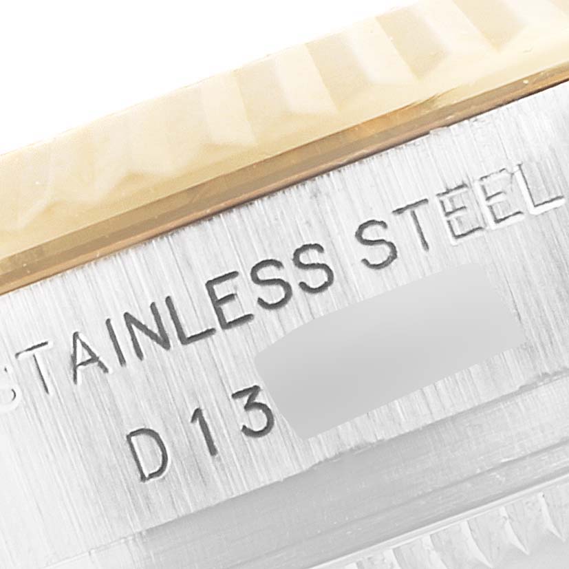 The image shows a close-up angle of the stainless steel engraving on the case of a Rolex Datejust 179173 Women's Steel and Gold (two tone) Mother of Pearl Dial 179173 Women's Steel and Gold (two tone) Mother of Pearl Dial.