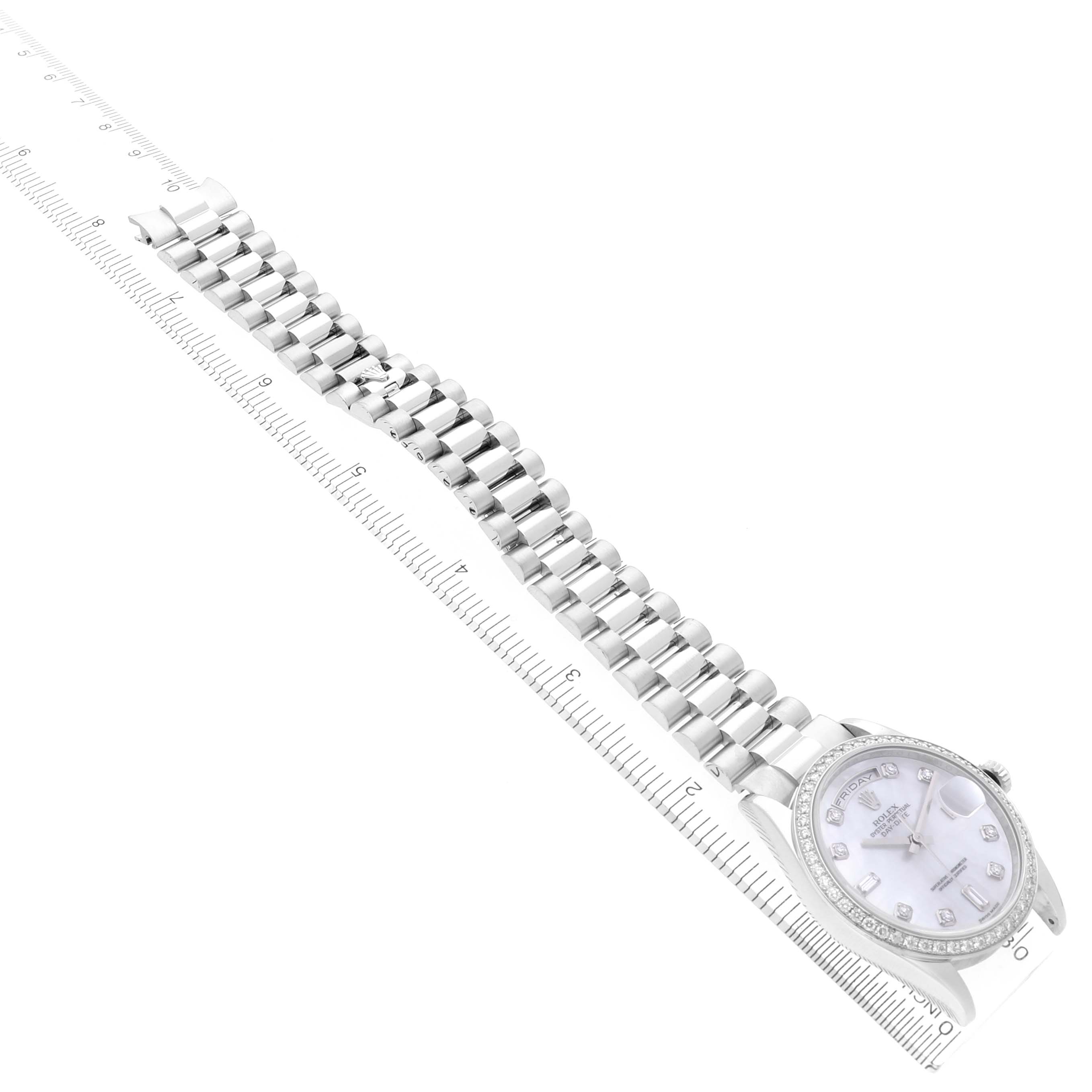 The image shows the Rolex President 118346NG Men's Platinum Mother of Pearl Dial 118346NG Men's Platinum Mother of Pearl Dial watch at a slight diagonal angle, displaying the full bracelet and watch face next to a measuring ruler.
