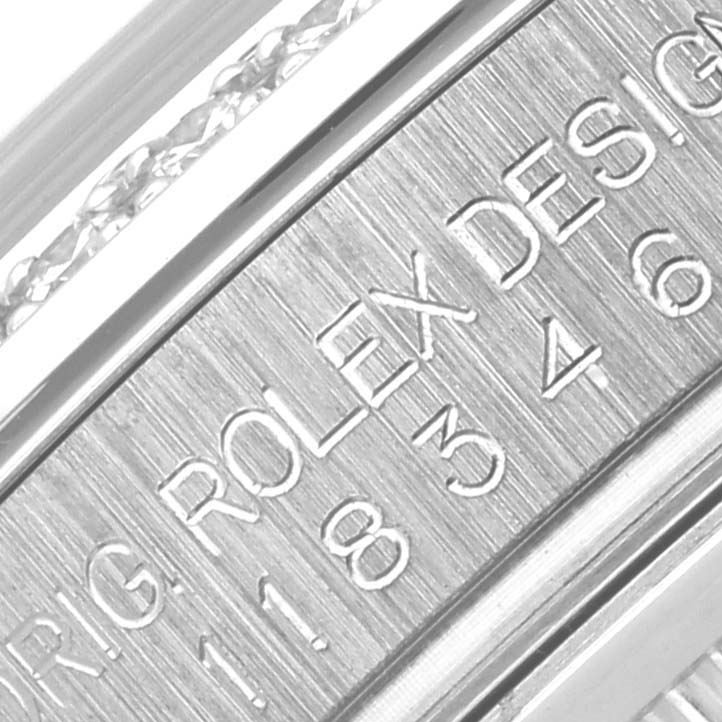 The image shows an angled close-up of the inner case engraving on a Rolex President 118346NG Men's Platinum Mother of Pearl Dial 118346NG Men's Platinum Mother of Pearl Dial watch.