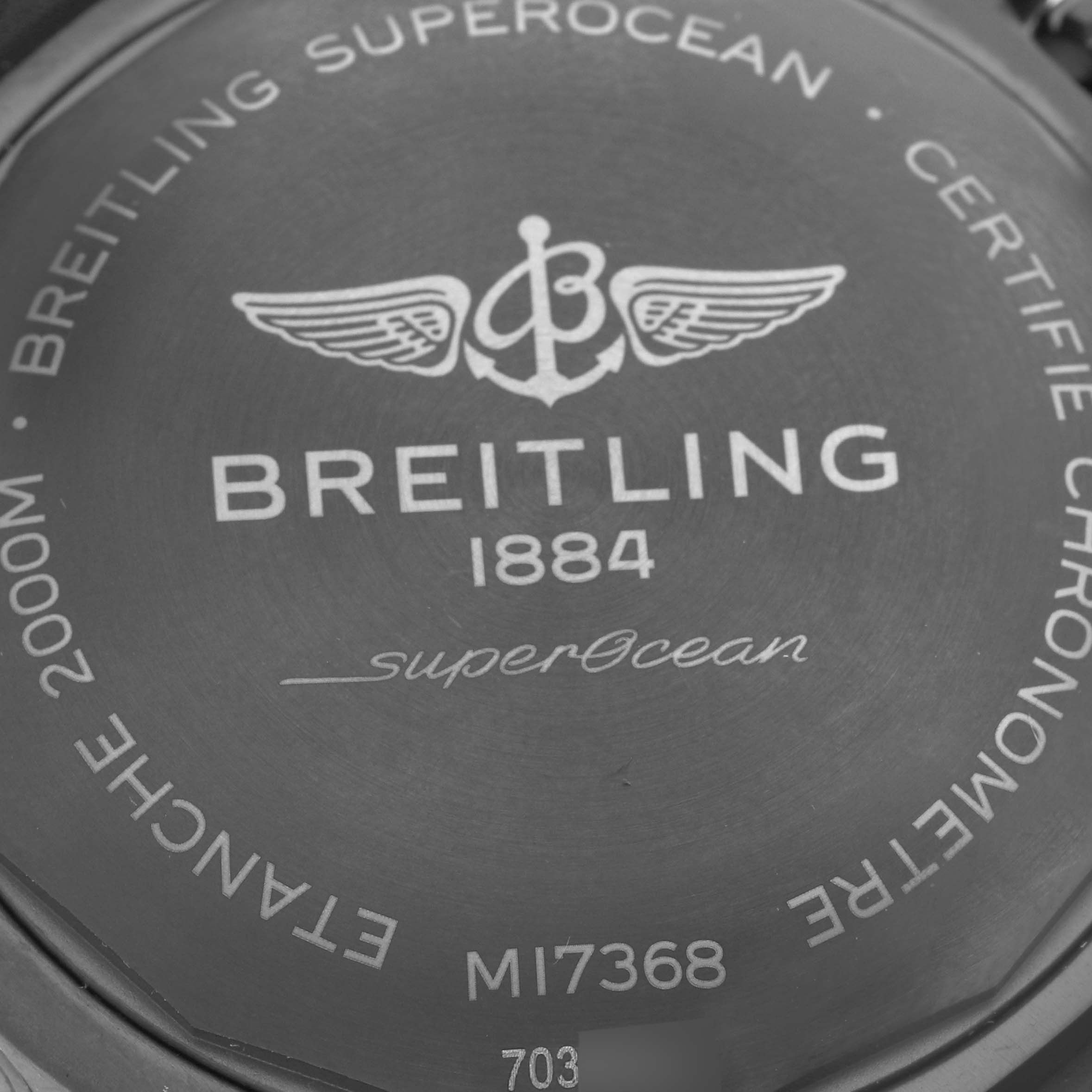 The image shows the back case of the Breitling Superocean M17368 Men's Stainless Steel Blue Dial M17368 Men's Stainless Steel Blue Dial watch, highlighting its branding and model details.