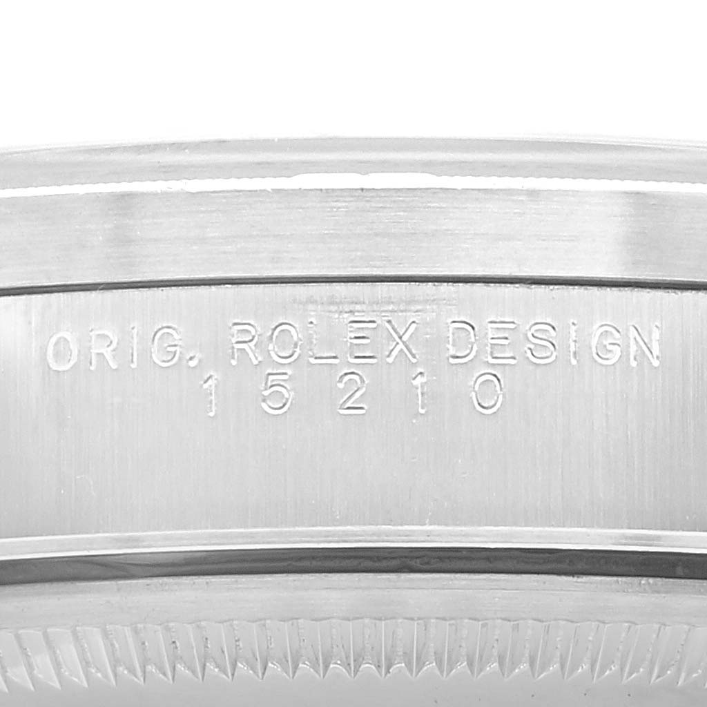 This image shows a close-up of the model number engraving on the case side of a Rolex Date 15210 Men's Stainless Steel Black Dial 15210 Men's Stainless Steel Black Dial watch.