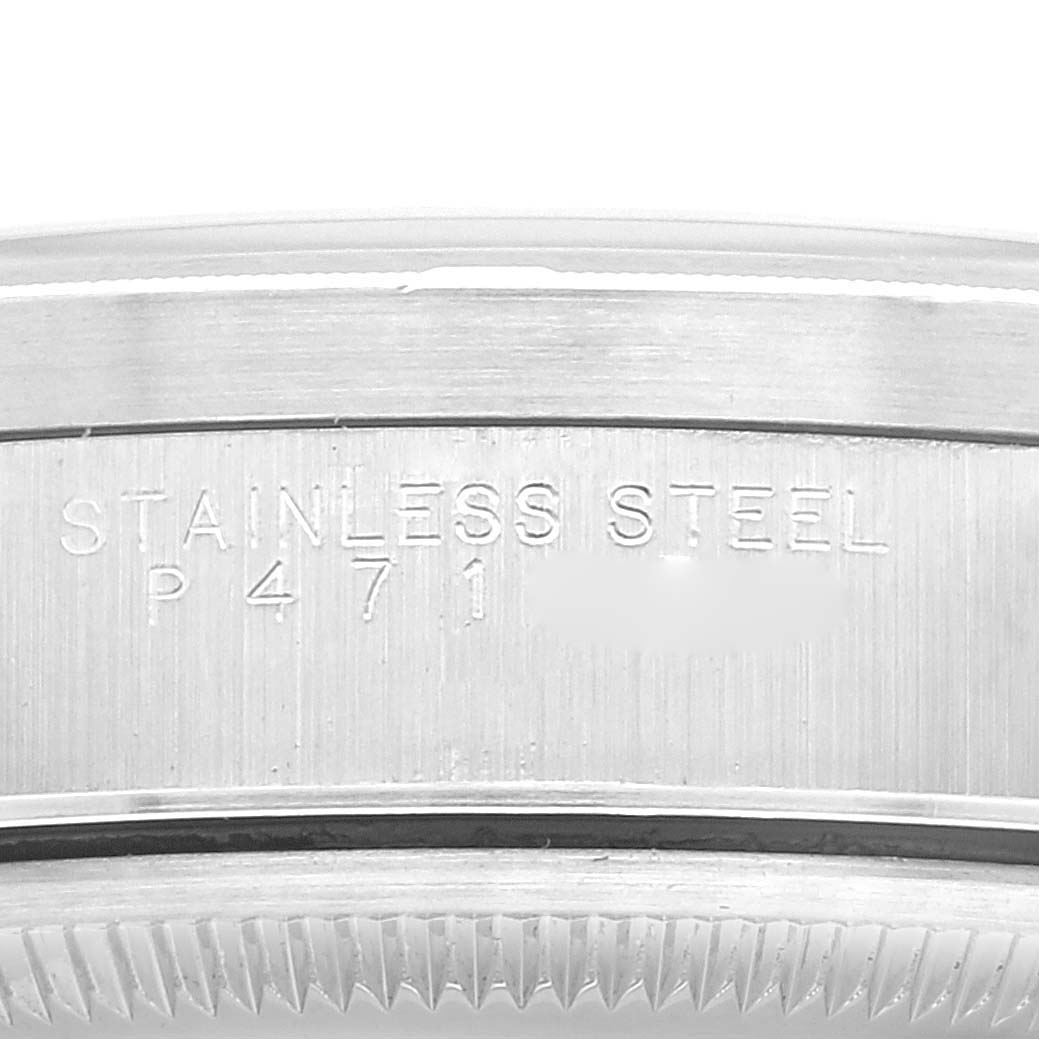 This image shows the side engraving of the stainless steel case of a Rolex Date 15210 Men's Stainless Steel Black Dial 15210 Men's Stainless Steel Black Dial model watch.