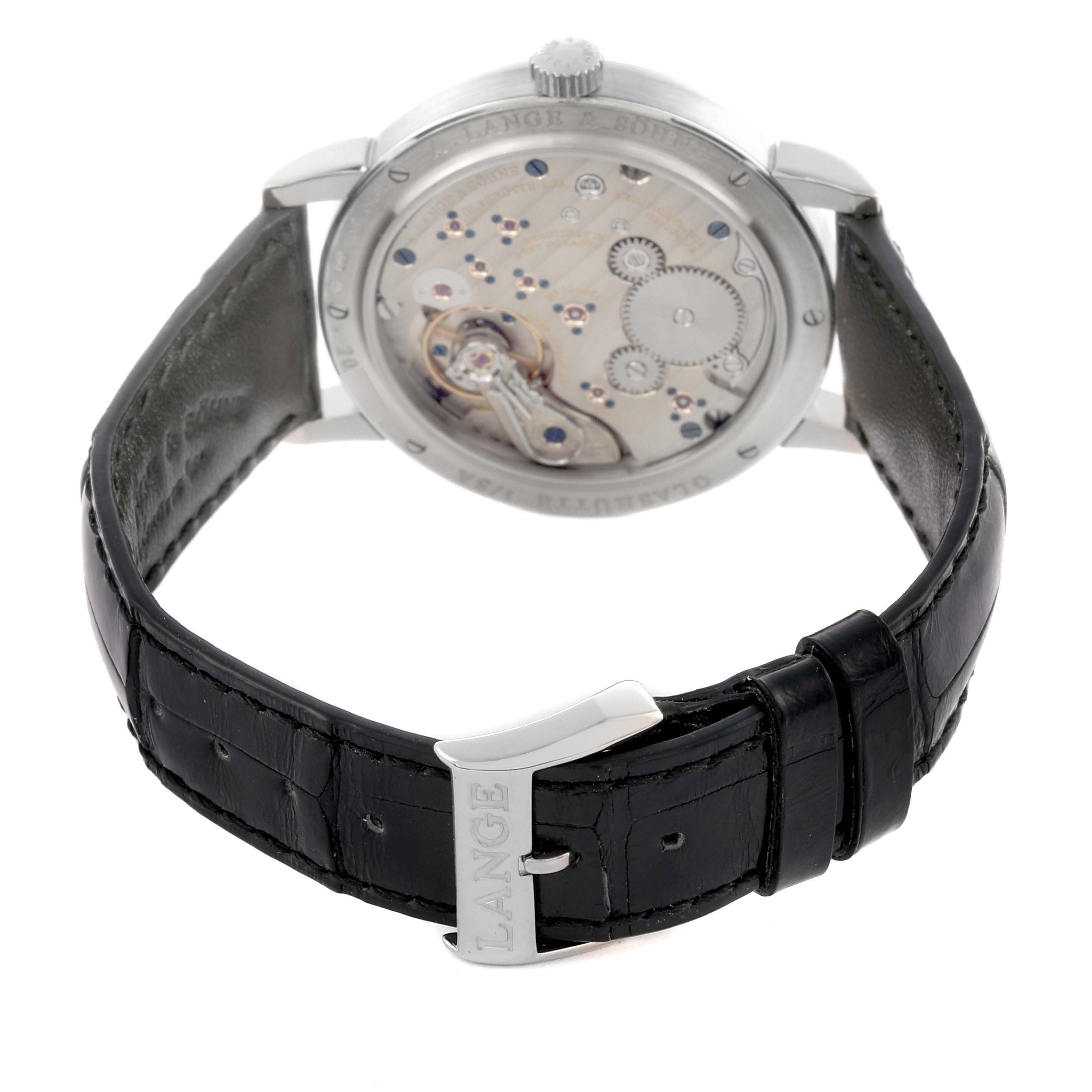 The image shows the back view of the A. Lange & Sohne 1815 234.026 Men's White Gold Silver Dial model, highlighting the movement and leather strap.