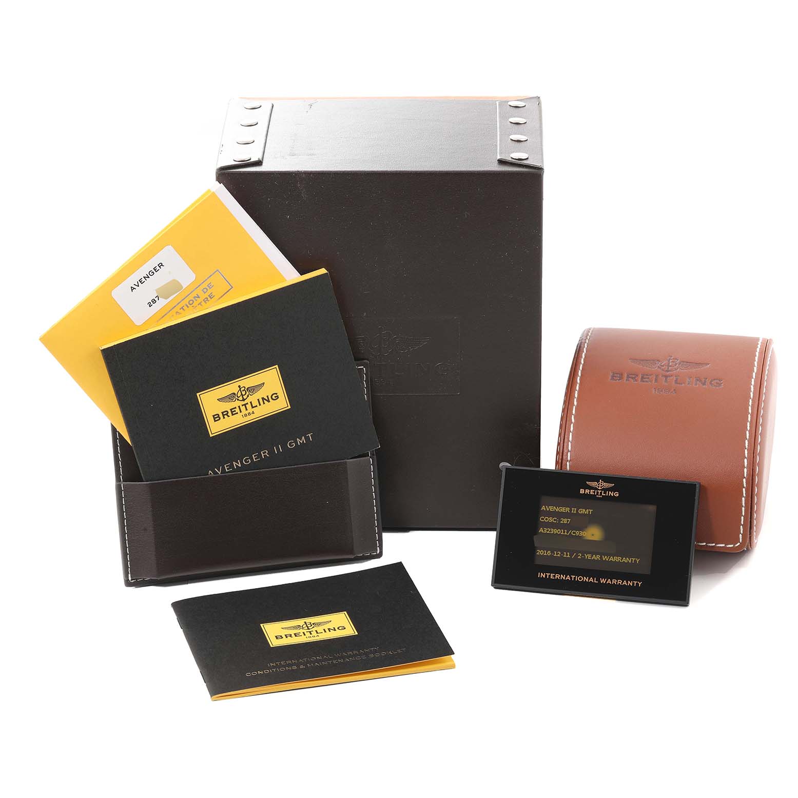 The image shows Breitling Avenger A3239011/C930 Men's Stainless Steel Mother of Pearl Dial A3239011/C930 Men's Stainless Steel Mother of Pearl Dial watch accessories including a box, manuals, warranty card, and a leather case, viewed from the front.