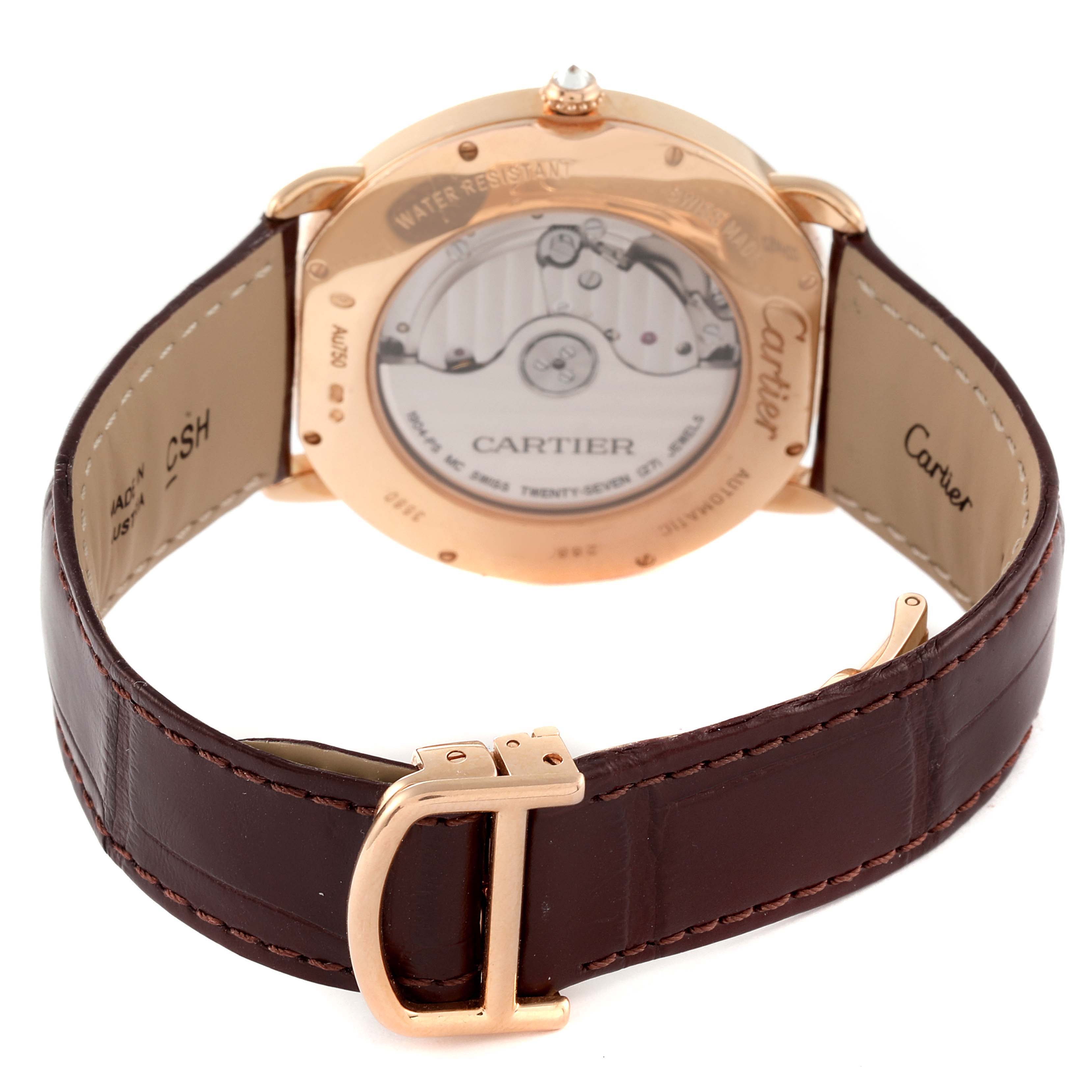 This Cartier Ronde WR007017 Men's Rose Gold Silver Dial WR007017 Men's Rose Gold Silver Dial watch is shown from the back, displaying its transparent case back and brown leather strap with a gold buckle.