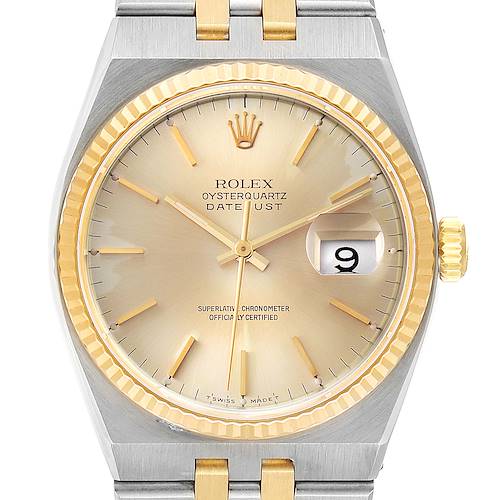 The Rolex Oysterquartz 17013 Men's Steel and Gold (two tone) Champagne Dial 17013 Men's Steel and Gold (two tone) Champagne Dial Datejust watch is shown from a front angle, highlighting the dial, bezel, and part of the bracelet.