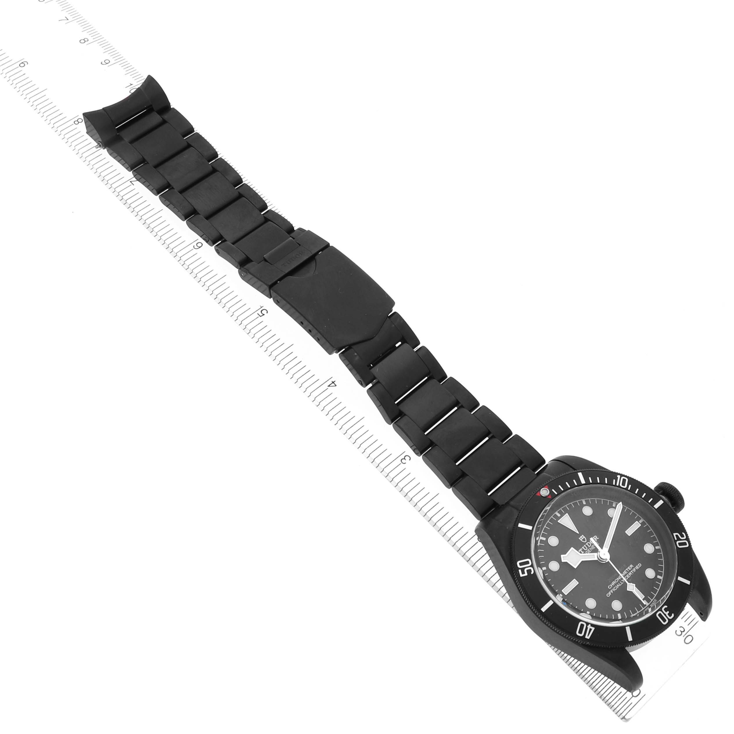 The Tudor Heritage Black Bay 79230DK Men's Stainless Steel Black Dial 79230DK Men's Stainless Steel Black Dial watch is shown from a top angle with a full view of the face and strap.