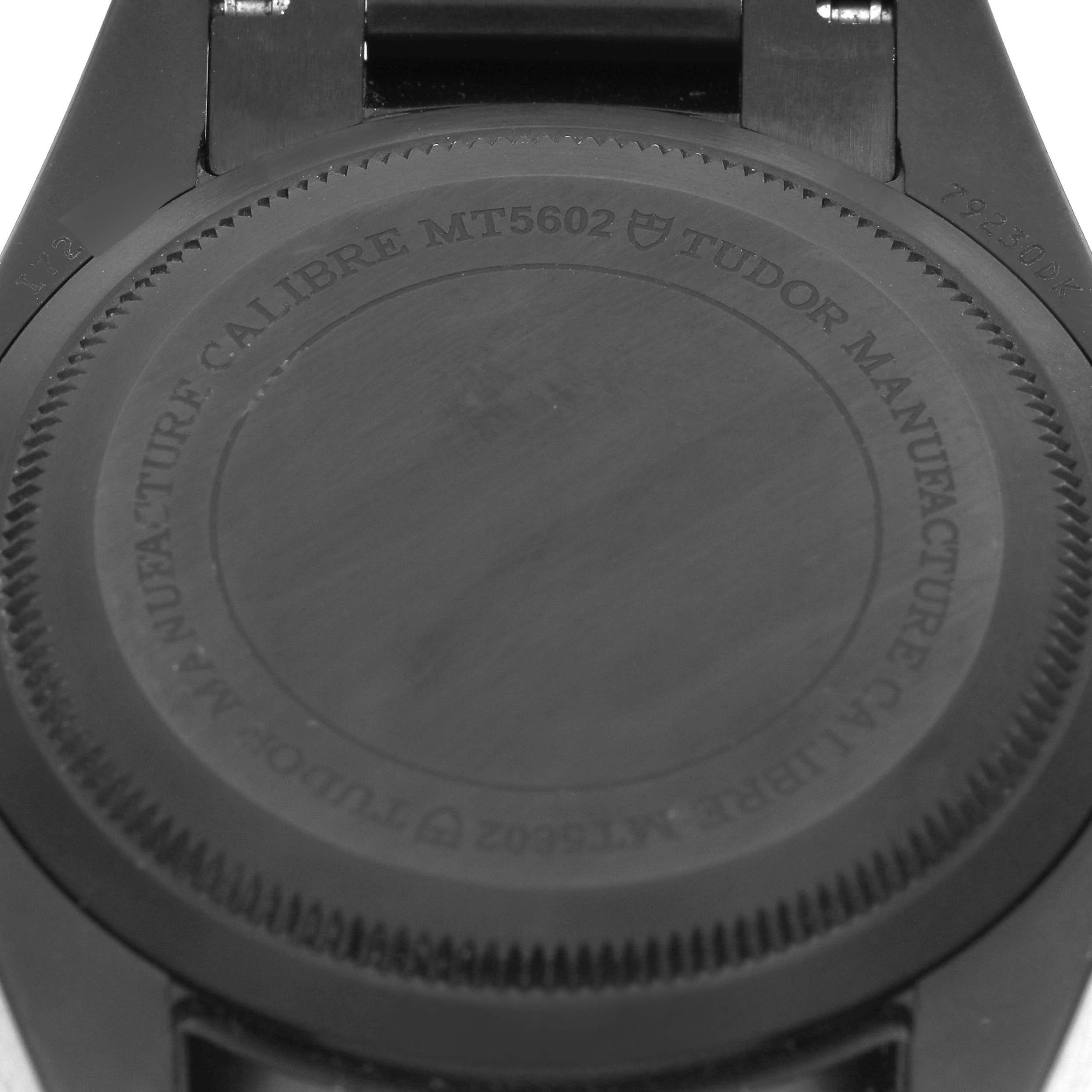 The image shows the back case of a Tudor Heritage Black Bay 79230DK Men's Stainless Steel Black Dial 79230DK Men's Stainless Steel Black Dial watch, focusing on the engraved details.