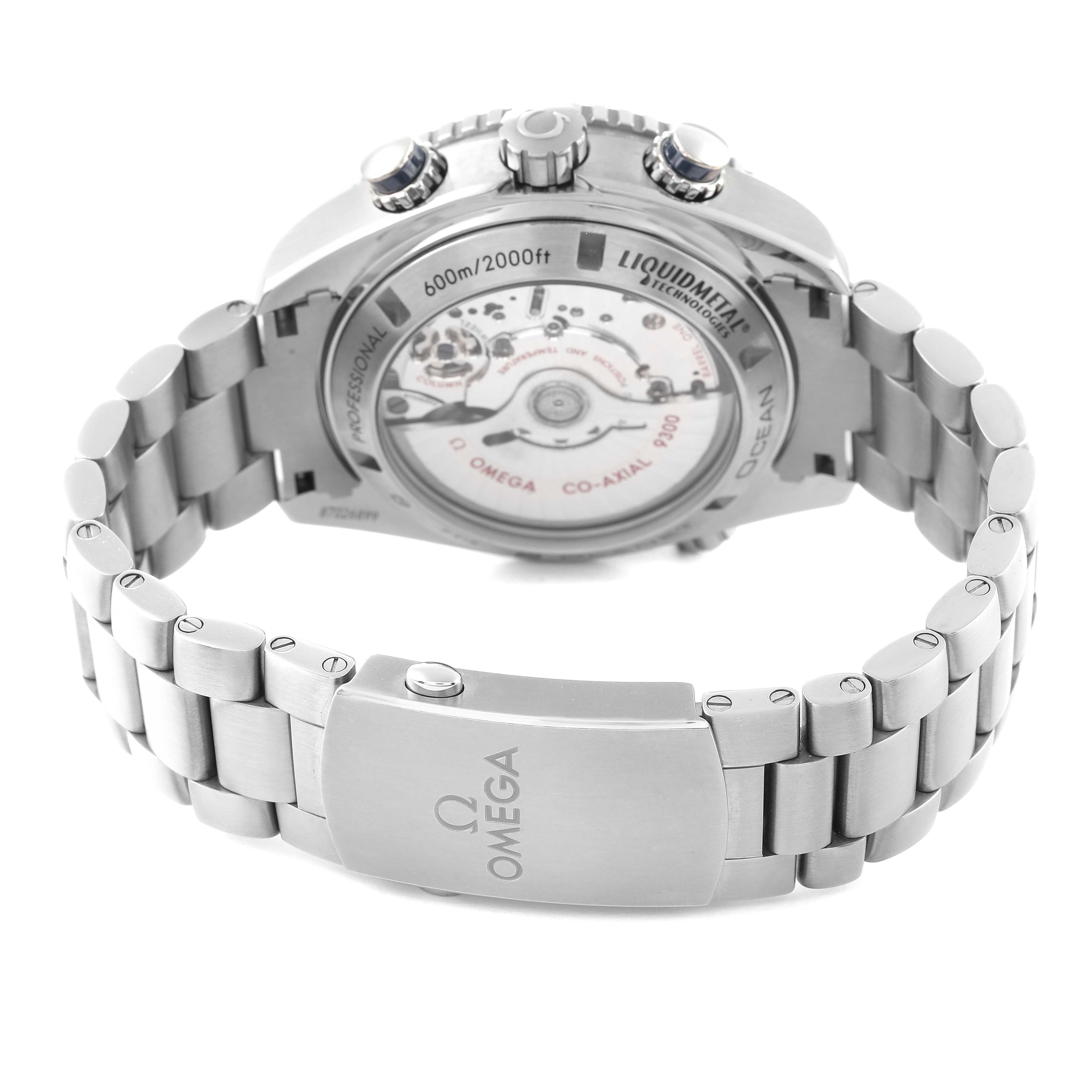 The image shows the back view of an Omega Planet Ocean 232.90.46.51.03.001 Men's Titanium Blue Dial 232.90.46.51.03.001 Men's Titanium Blue Dial watch, highlighting the stainless steel bracelet and the transparent case back.