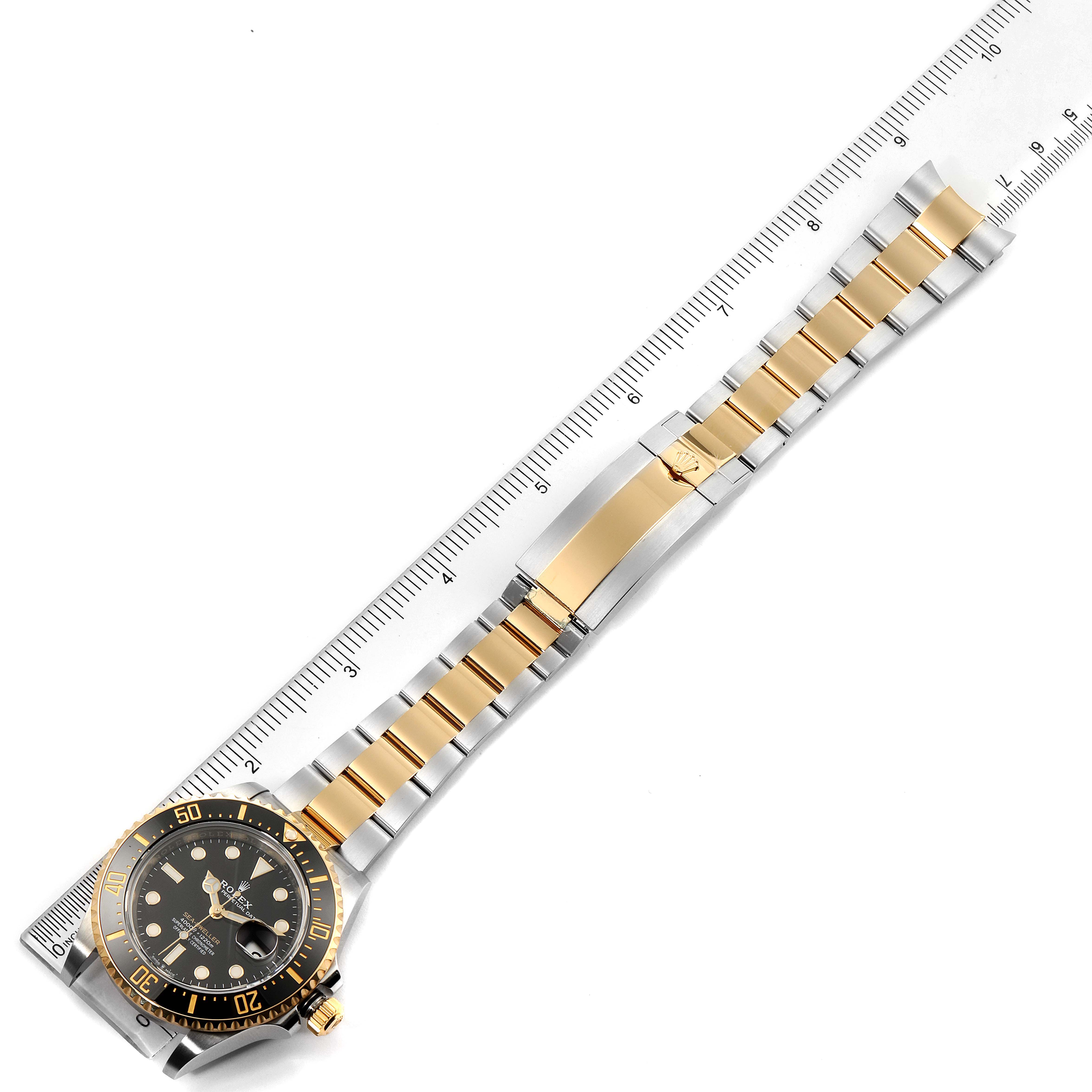 This Rolex Sea-Dweller 126603 Men's Steel and Gold (two tone) Black Dial 126603 Men's Steel and Gold (two tone) Black Dial watch is shown from an overhead angle, displaying the full bracelet, bezel, and face.