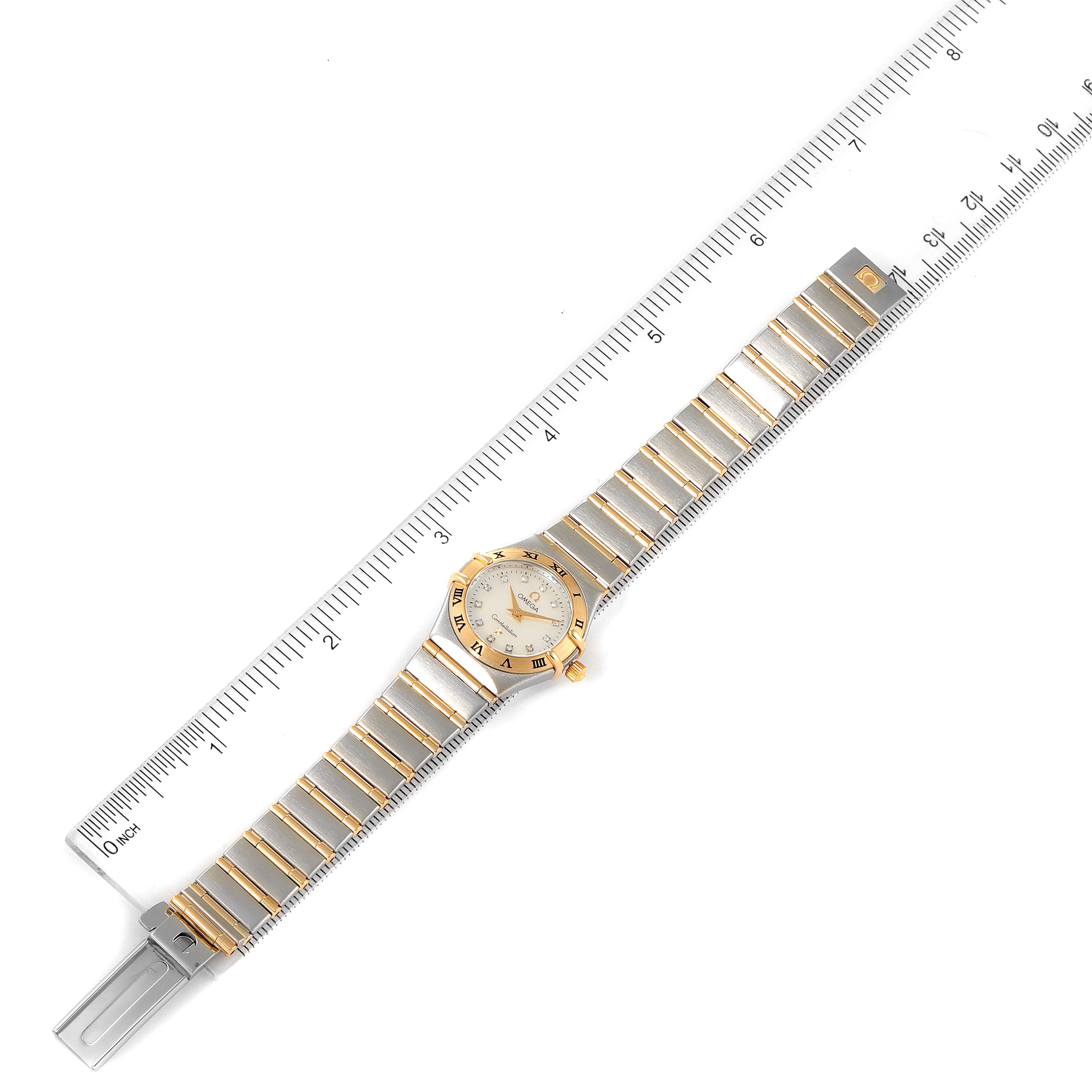 The image shows an Omega 1262.75.00 Women's Steel and Gold (two tone) Mother of Pearl Dial 1262.75.00 Women's Steel and Gold (two tone) Mother of Pearl Dial Constellation Steel Yellow Gold MOP Diamond Ladies Watch 1262.75.00 flat, with a ruler indicating length.