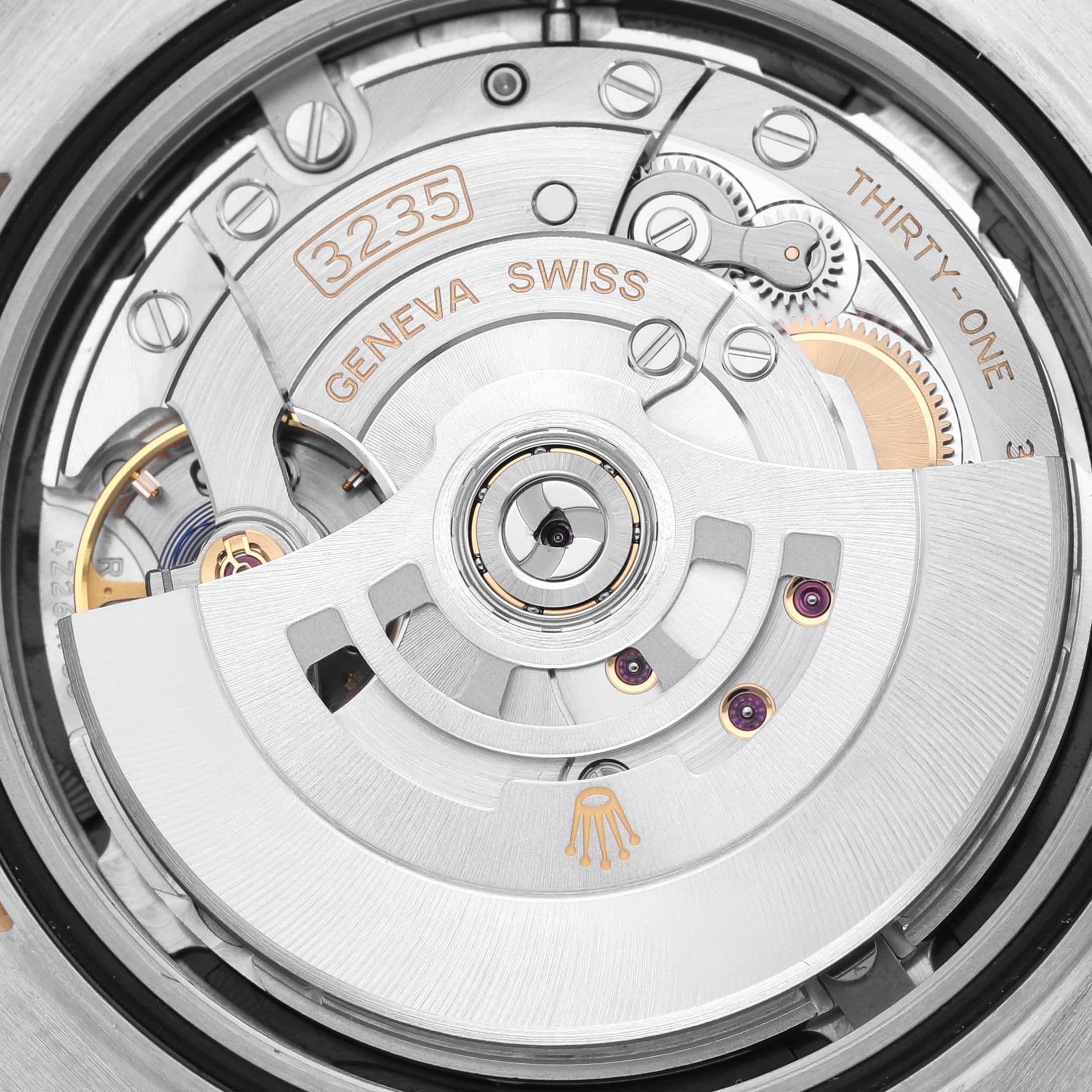 The image shows the intricate movement mechanism of the Rolex Datejust 41 126333 Men's Steel and Gold (two tone) Black Dial 126333 Men's Steel and Gold (two tone) Black Dial, highlighting its inner components.