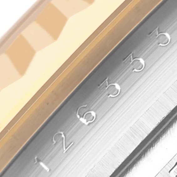 The image shows a close-up side view of the bezel and date wheel on a Rolex Datejust 41 126333 Men's Steel and Gold (two tone) Black Dial 126333 Men's Steel and Gold (two tone) Black Dial.