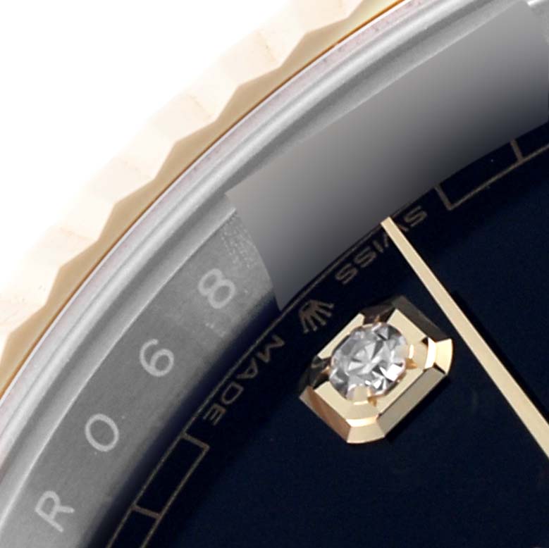 The image shows a close-up of the Rolex Datejust 41 126333 Men's Steel and Gold (two tone) Black Dial 126333 Men's Steel and Gold (two tone) Black Dial watch, highlighting the bezel, dial edge, and diamond hour marker.