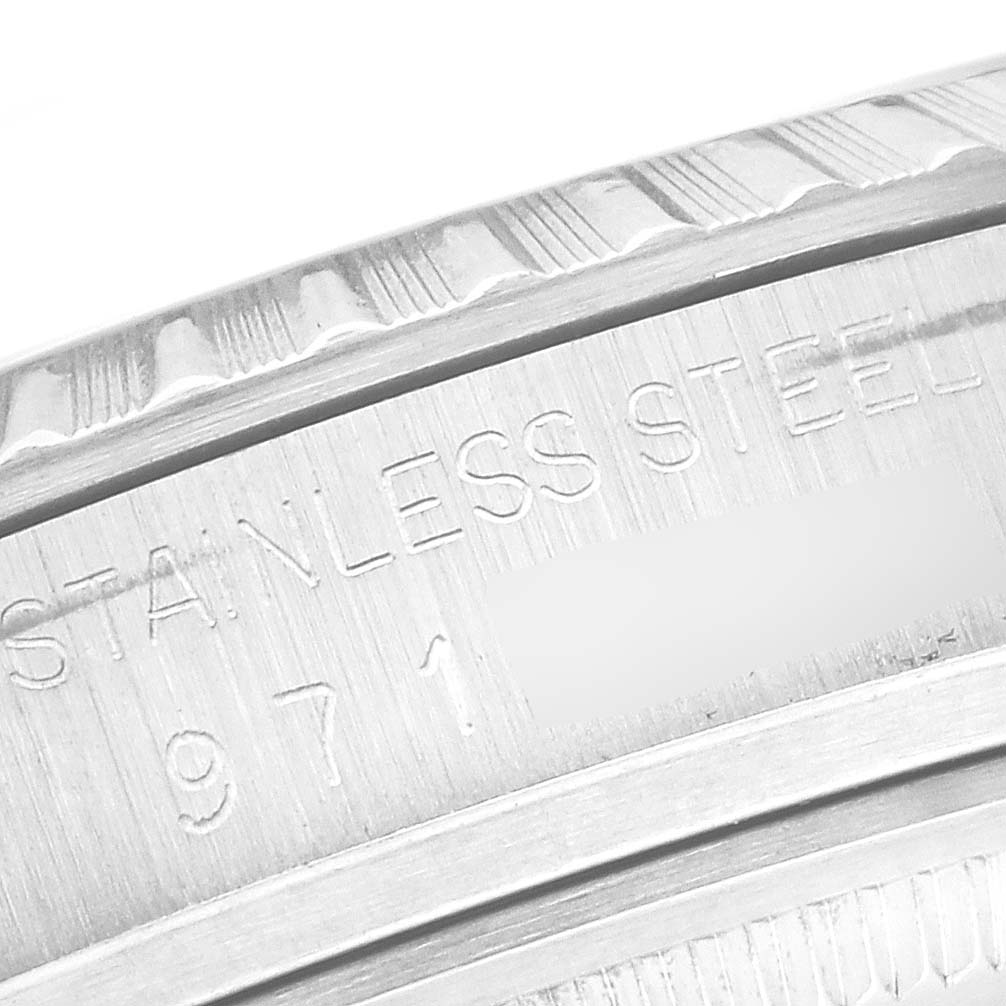 The image shows a close-up of the engraved bezel and inner ring of a Rolex Datejust 16030 Men's Stainless Steel Silver Dial 16030 Men's Stainless Steel Silver Dial watch.