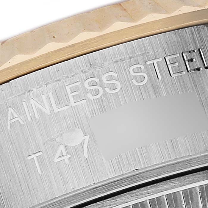 The close-up image shows the edge of the bezel and engravings on the stainless steel case back of the Rolex Datejust 69173 Women's Steel and Gold (two tone) Silver Dial 69173 Women's Steel and Gold (two tone) Silver Dial.