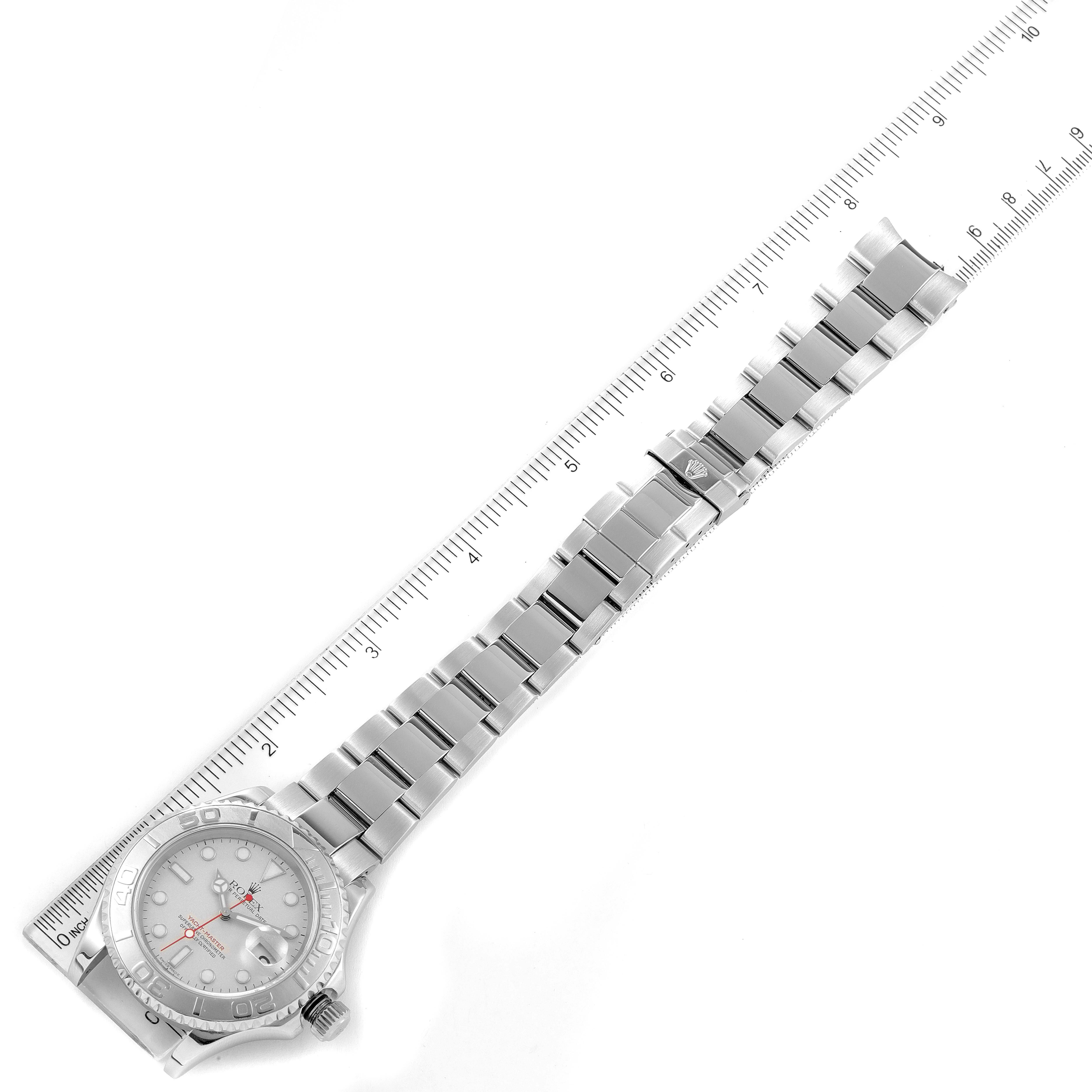 The image shows a top-down angle of a Rolex Yacht-Master 16622 Men's Stainless Steel Silver Dial 16622 Men's Stainless Steel Silver Dial watch, displaying its bracelet, case, and dial alongside a measuring scale.