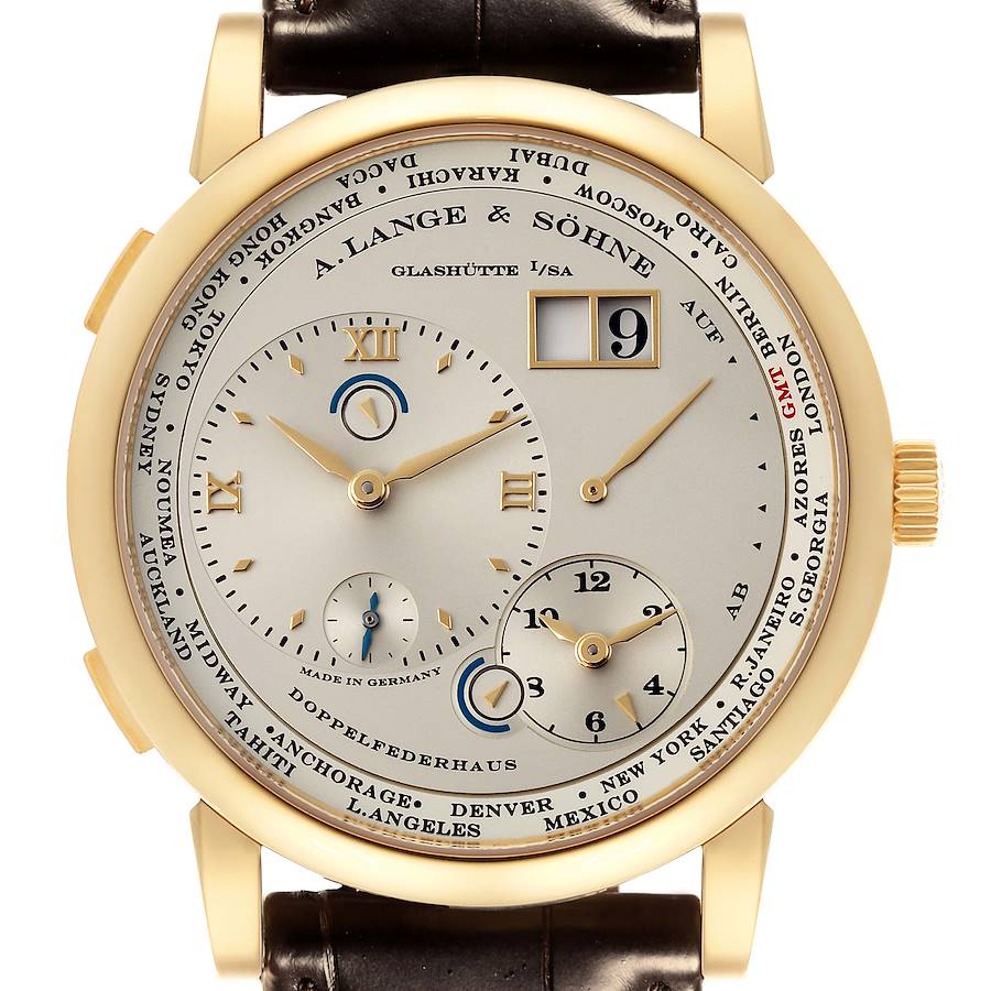 The A. Lange & Sohne Lange 1 116.021 Men's Yellow Gold Silver Dial is shown from a front angle, displaying its dial, hands, date window, and strap attachment.