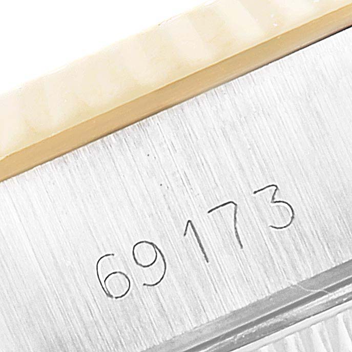 This image shows the case model number of the Rolex Datejust 69173 Women's Steel and Gold (two tone) Champagne Dial 69173 Women's Steel and Gold (two tone) Champagne Dial, focusing on the side of the watch case.