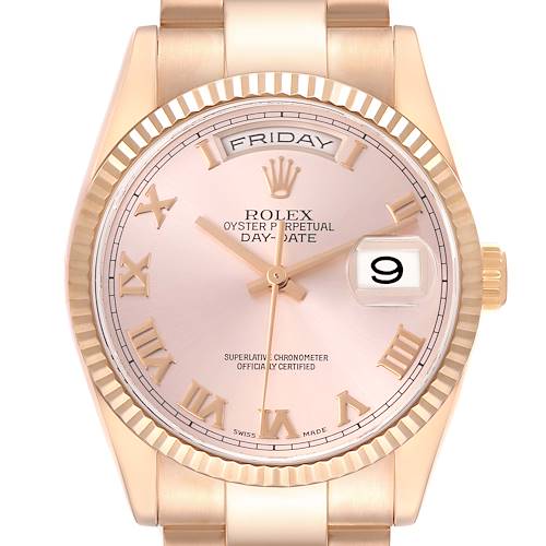 The Rolex President 118235 Men's Rose Gold Pink Dial 118235 Men's Rose Gold Pink Dial model is shown from a front angle, displaying its dial, hands, date window, and bracelet.