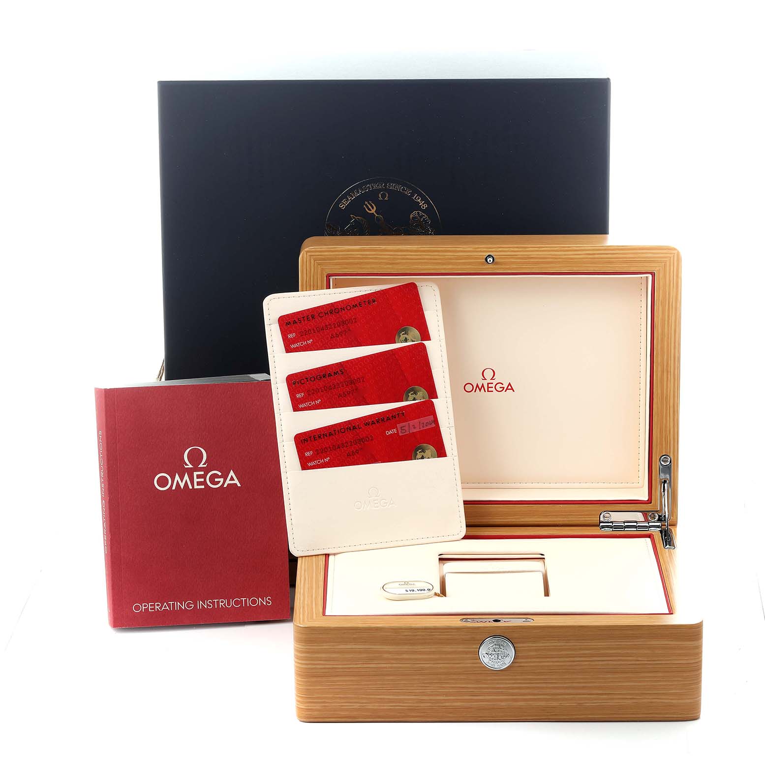 The image shows an Omega Seamaster 220.10.43.22.03.002 Men's Stainless Steel Blue Dial 220.10.43.22.03.002 Men's Stainless Steel Blue Dial box, with cards, a warranty case, and an operating manual.