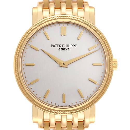 The image shows a front view of the Patek Philippe Calatrava 5120/1J-001 Men's Yellow Gold Silver Dial 5120/1J-001 Men's Yellow Gold Silver Dial watch, highlighting the dial and gold bracelet.