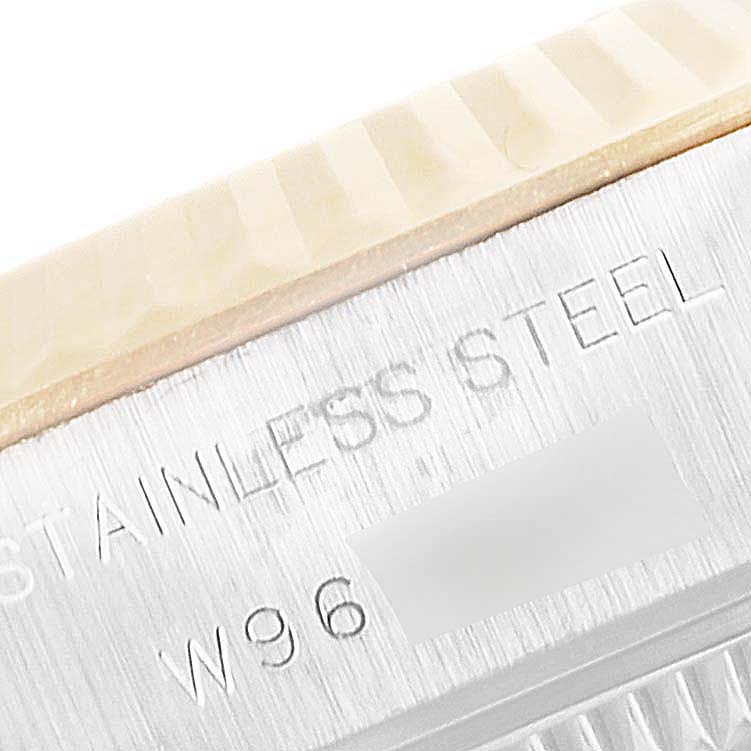 The image shows a close-up of the stainless steel case and fluted bezel of a Rolex Datejust 69173 Women's Steel and Gold (two tone) Champagne Dial 69173 Women's Steel and Gold (two tone) Champagne Dial watch.