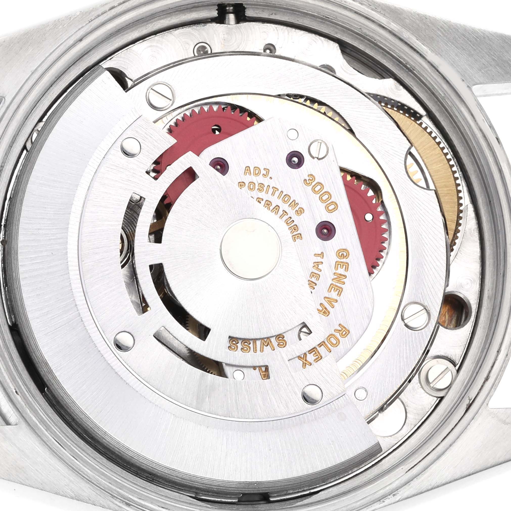 The image shows the internal mechanism of a Rolex Air-King 14000 Men's Stainless Steel Blue Dial 14000 Men's Stainless Steel Blue Dial watch, highlighting gears and engravings from a top-down angle.