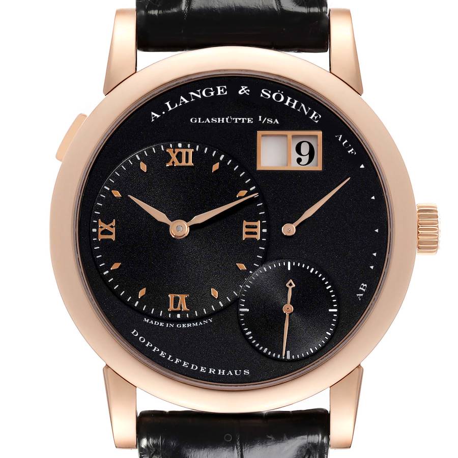 The A. Lange & Sohne Lange 1 101.031 Men's Rose Gold Black Dial watch is shown from a frontal angle, displaying its black dial, hour markers, subdials, and date window.