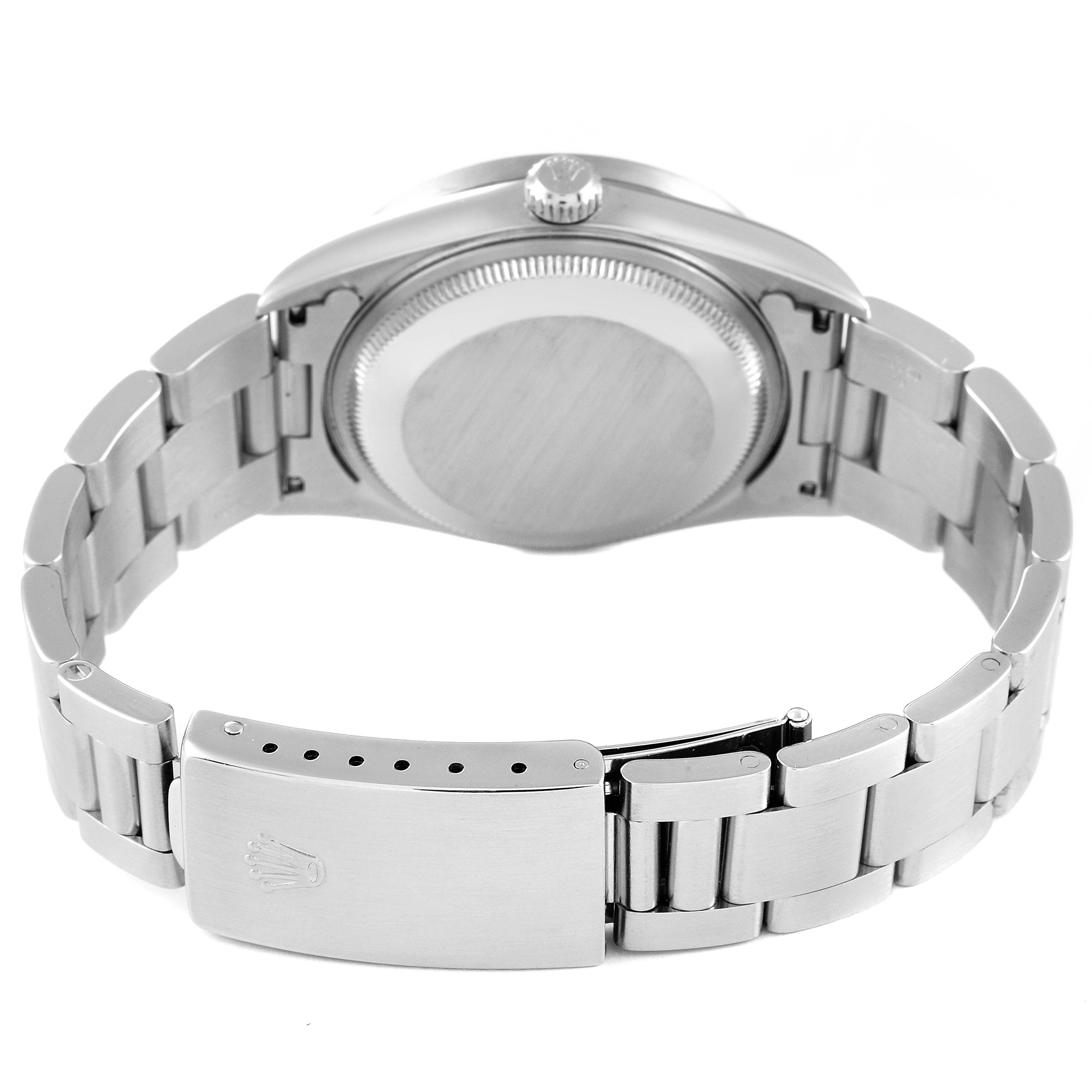 The image shows the back case and bracelet of a Rolex Date 15210 Men's Stainless Steel Black Dial 15210 Men's Stainless Steel Black Dial model watch from a rear view angle.