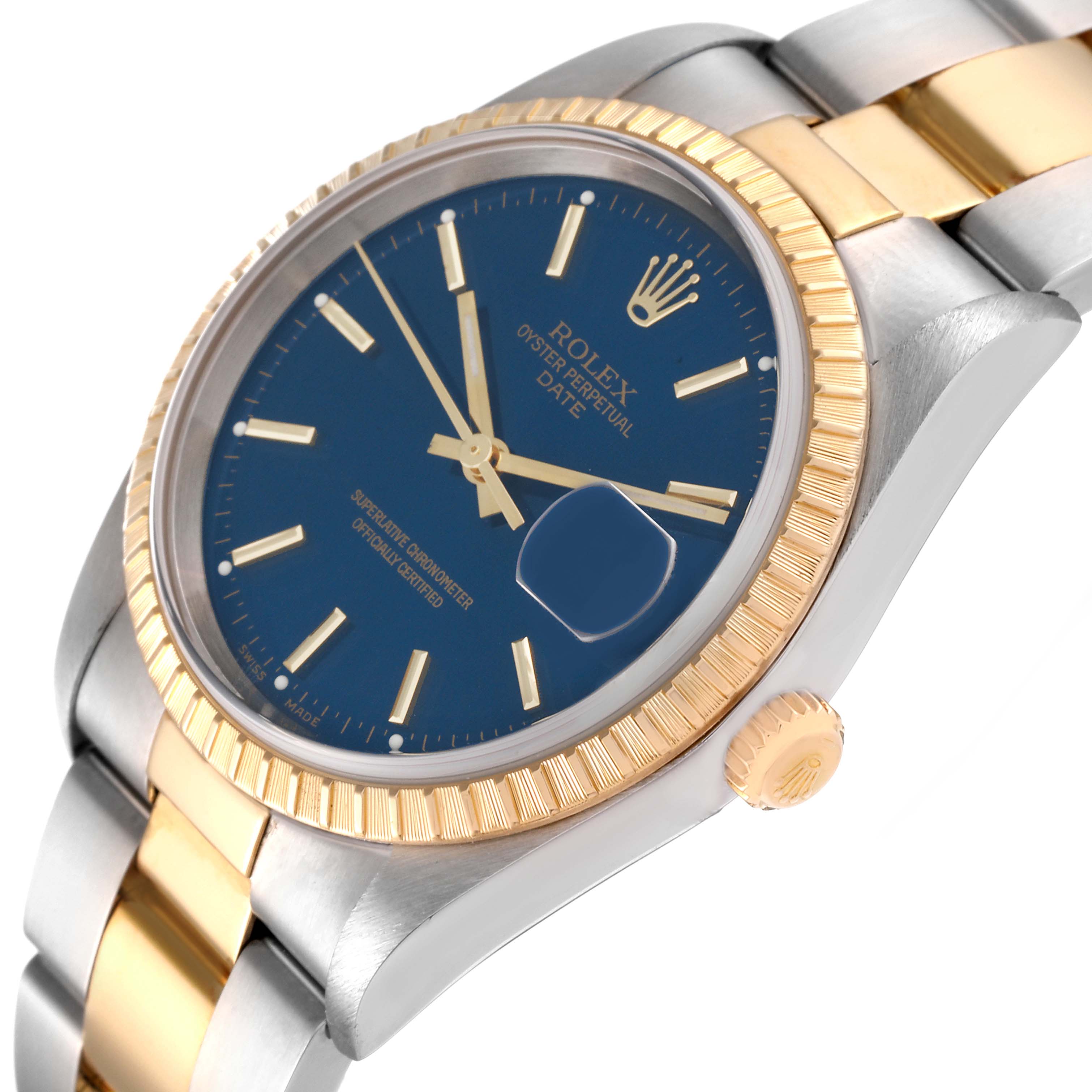 The image shows a Rolex Date 15223 Men's Steel and Gold (two tone) Blue Dial 15223 Men's Steel and Gold (two tone) Blue Dial watch at a slight angle, highlighting the blue dial, fluted bezel, and part of the bracelet.