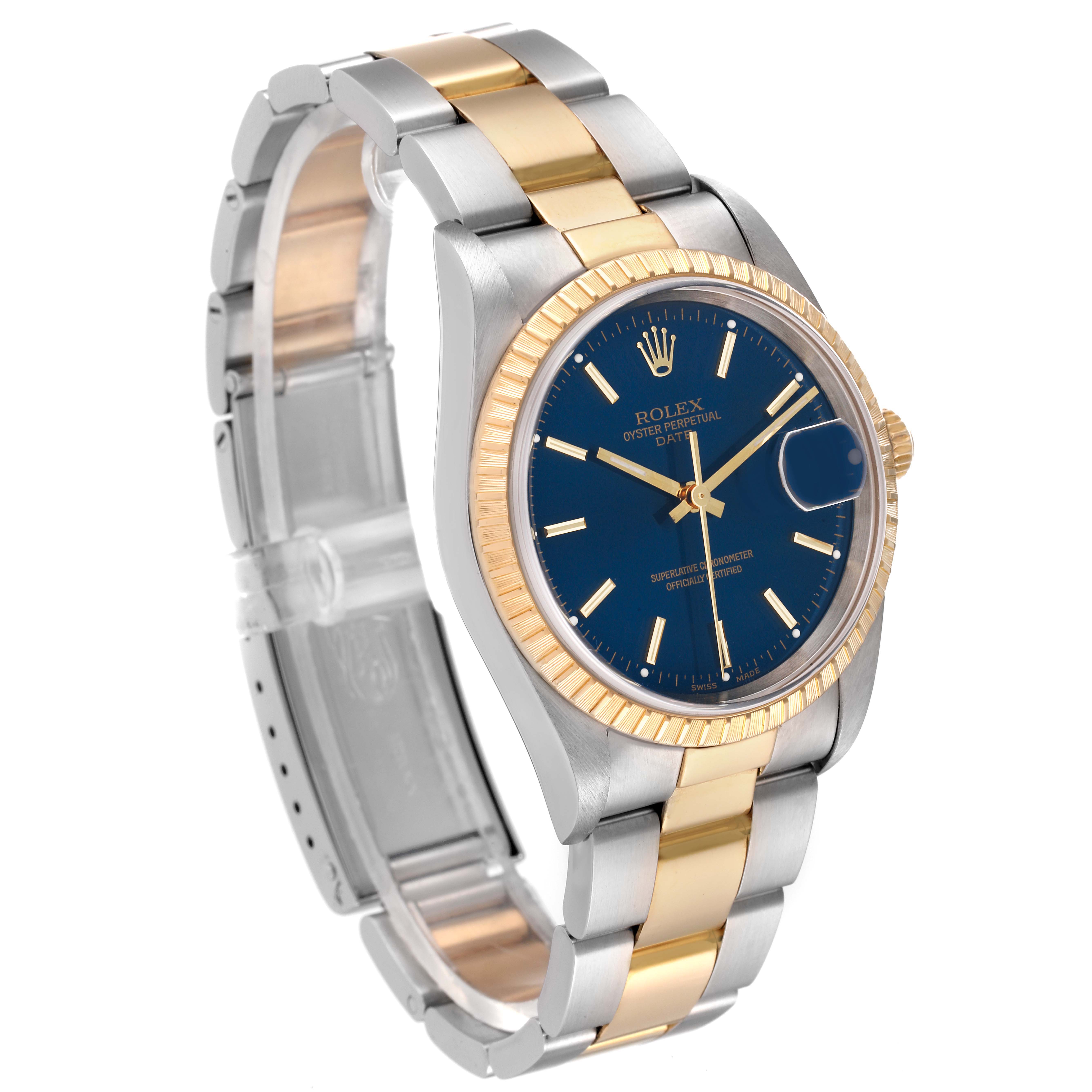 The image shows a Rolex Date 15223 Men's Steel and Gold (two tone) Blue Dial 15223 Men's Steel and Gold (two tone) Blue Dial with a blue dial, silver and gold bracelet, and fluted bezel at a three-quarter angle.