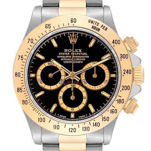 This image shows a front view of a Rolex Daytona 16523 Men's Steel and Gold (two tone) Black Dial 16523 Men's Steel and Gold (two tone) Black Dial watch, highlighting the bezel, dial, subdials, crown, and pushers.