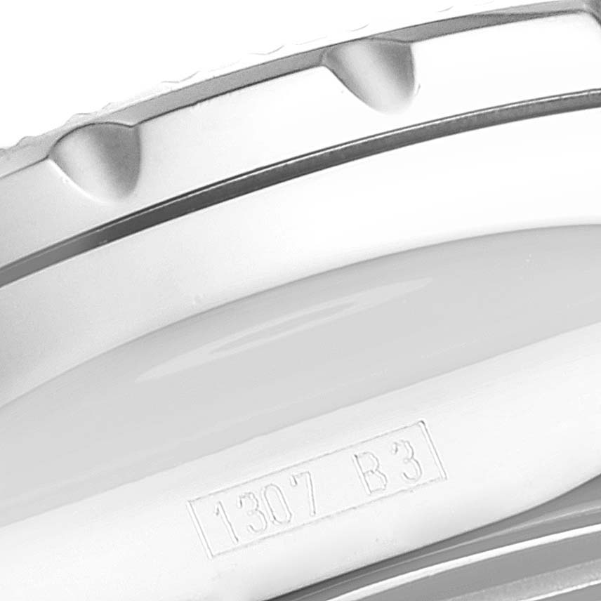 The image shows a close-up of the bezel and part of the case edge of a Bentley model by Breitling, with a serial number visible.