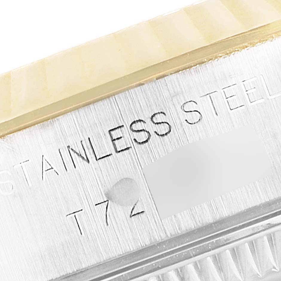 The image shows a close-up of the edge of the case and bezel of a Rolex Datejust 69173 Women's Steel and Gold (two tone) Blue Dial 69173 Women's Steel and Gold (two tone) Blue Dial, highlighting the "Stainless Steel" engraving.