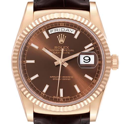The image shows a close-up front view of the dial, bezel, and part of the strap and crown of a Rolex President 118135 Men's Rose Gold Brown Dial 118135 Men's Rose Gold Brown Dial Day-Date watch.