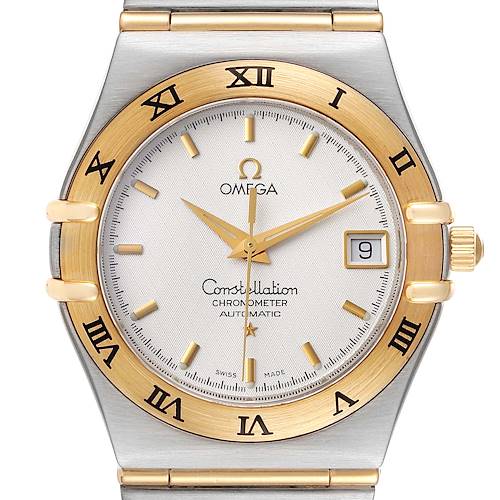 The image shows the front view of an Omega Constellation 1202.30.00 Men's Steel and Gold (two tone) Silver Dial 1202.30.00 Men's Steel and Gold (two tone) Silver Dial watch, highlighting the dial, hands, bezel, and part of the bracelet.