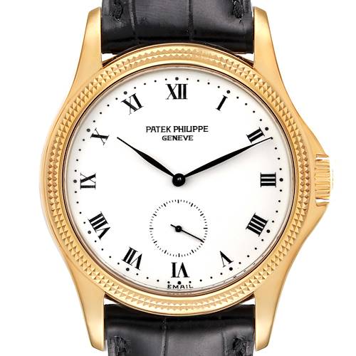 The image shows a frontal view of a Calatrava model watch by Patek Philippe, highlighting the face, hands, bezel, and leather strap.