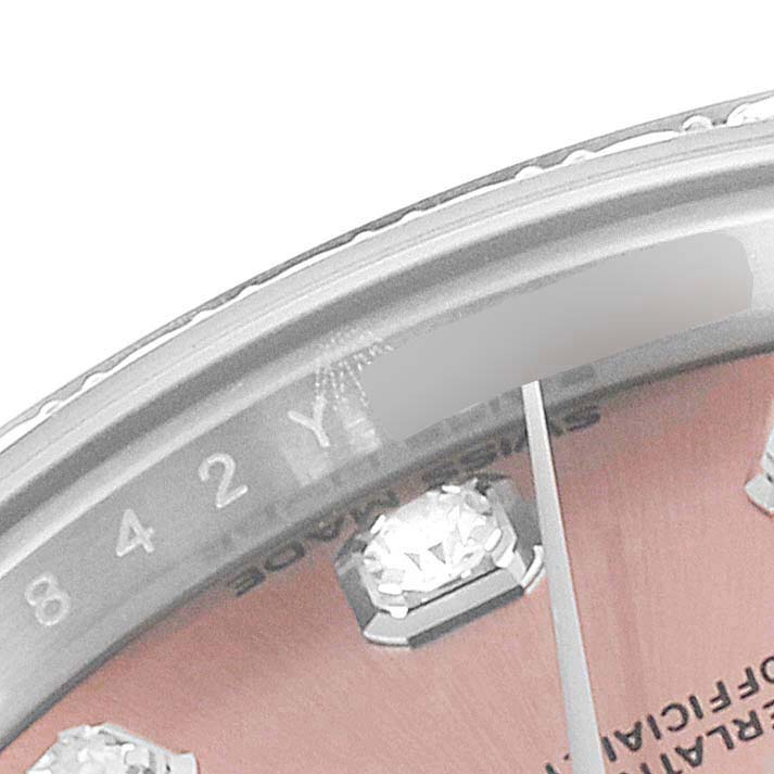 This image shows a close-up of the dial and indices, including some diamond marker details on a Rolex Datejust 279384 Women's Stainless Steel Pink Dial 279384 Women's Stainless Steel Pink Dial watch.