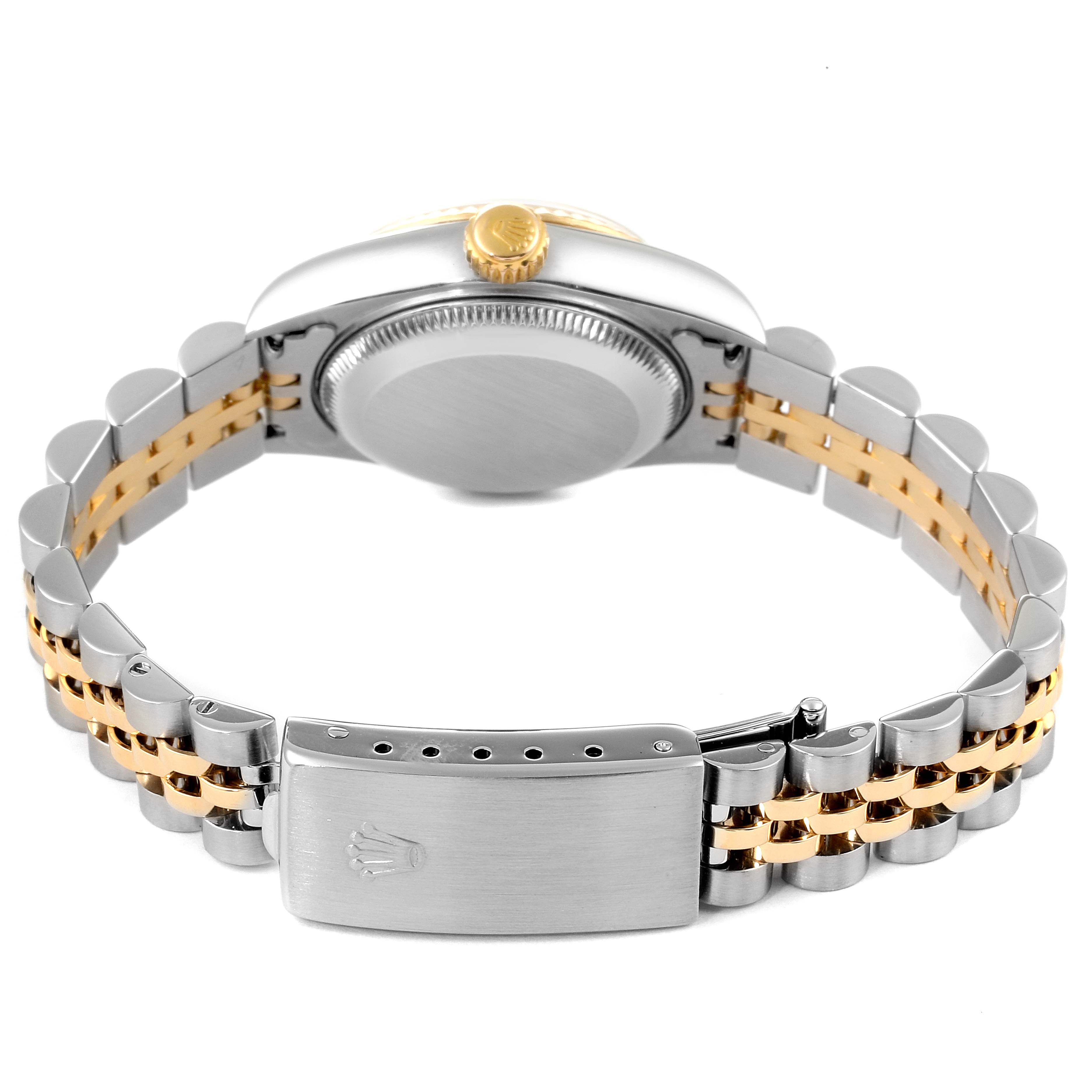 A Rolex Datejust 79173 Women's Steel and Gold (two tone) Mother of Pearl Dial 79173 Women's Steel and Gold (two tone) Mother of Pearl Dial watch is shown from the back, highlighting its two-tone bracelet, clasp, case back, and crown.