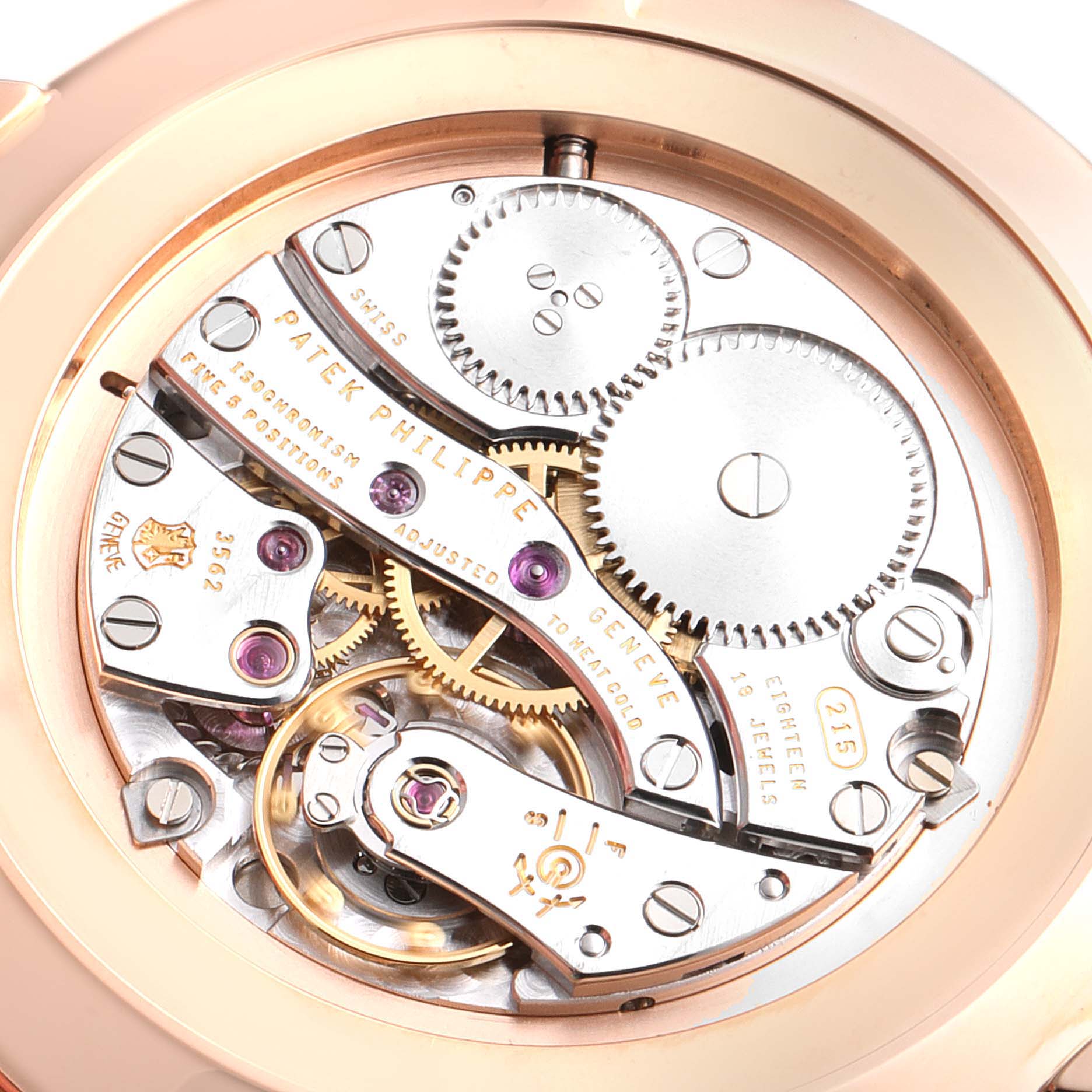 The image shows the inner mechanical movement of a Patek Philippe Calatrava 5119R Men's Rose Gold White Dial 5119R Men's Rose Gold White Dial watch from a close-up, rear-view angle.