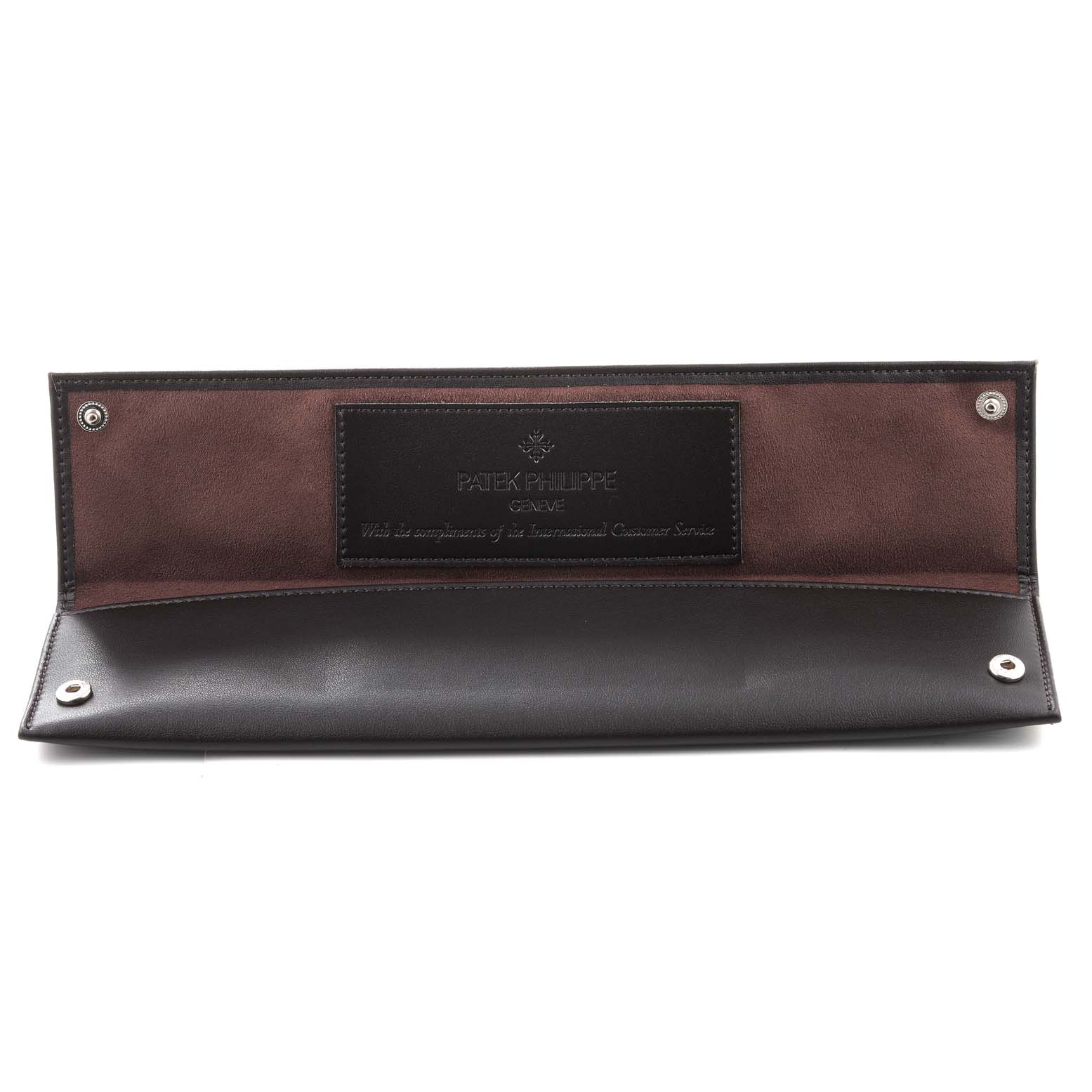 This image shows an open leather case for the Patek Philippe Calatrava 5119R Men's Rose Gold White Dial 5119R Men's Rose Gold White Dial watch, featuring the brand's logo and message inside.