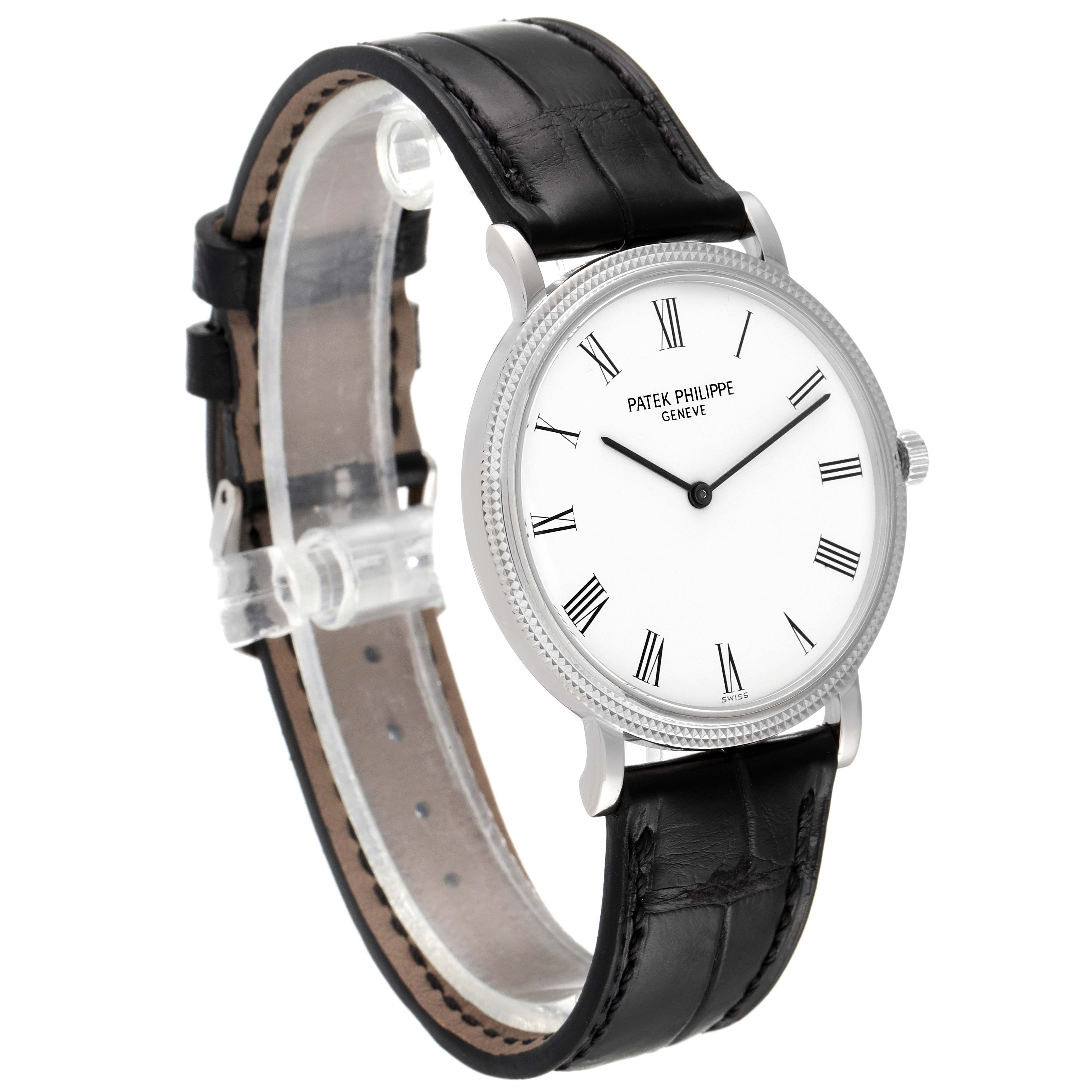 The image shows a Patek Philippe Calatrava 5120G Men's White Gold White Dial 5120G Men's White Gold White Dial watch, featuring a clear view of its face, bezel, and black leather strap from a slightly angled side view.