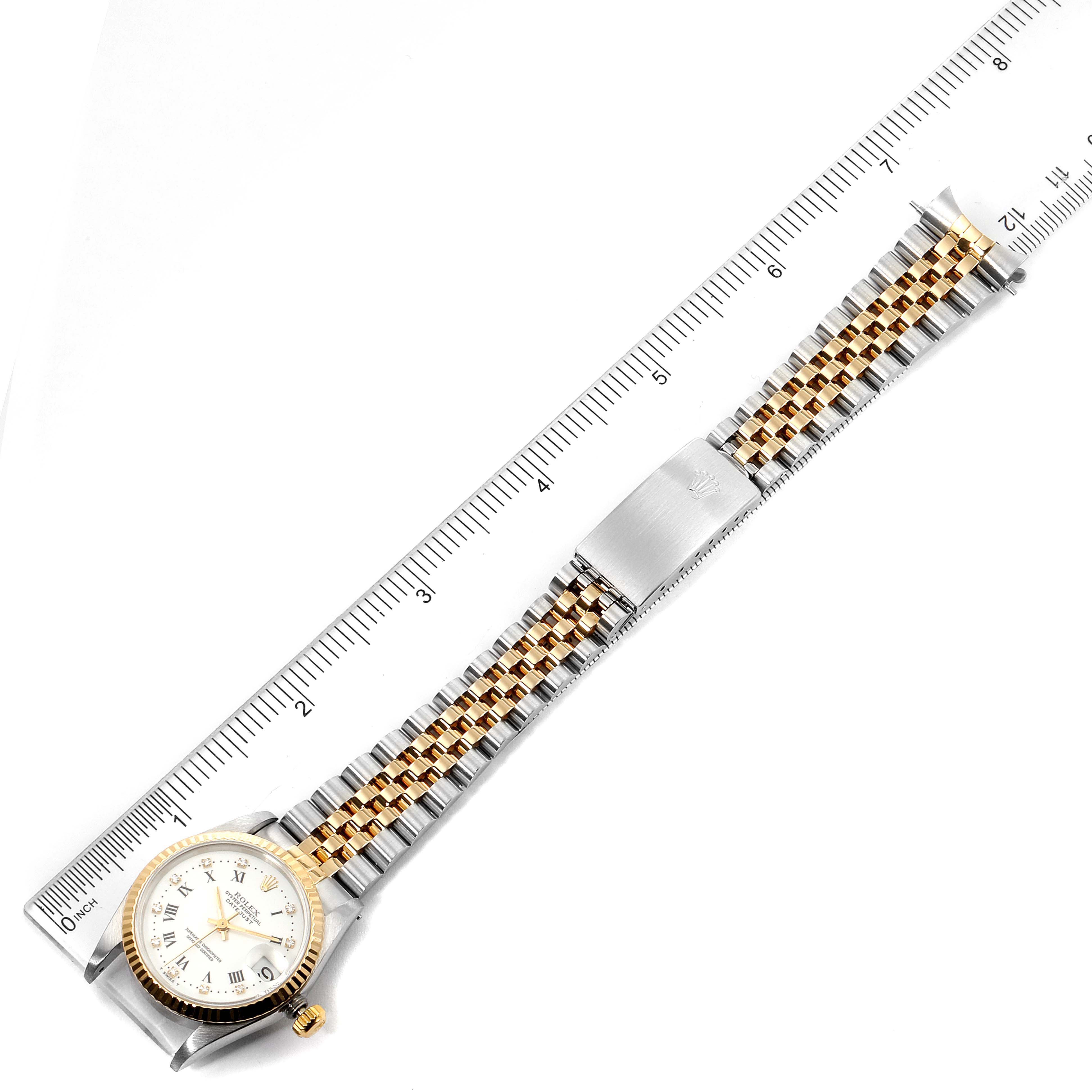 The image shows the front view of a Rolex Datejust 68273 Women's Steel and Gold (two tone) White Dial 68273 Women's Steel and Gold (two tone) White Dial watch, including the face and entire bracelet, which is aligned with a ruler for measurement.