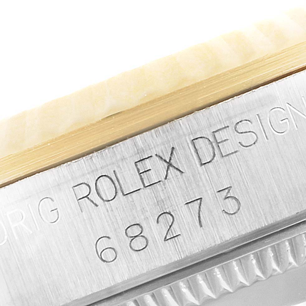 The image shows a close-up of the engraved model number and bezel of a Rolex Datejust 68273 Women's Steel and Gold (two tone) White Dial 68273 Women's Steel and Gold (two tone) White Dial watch.