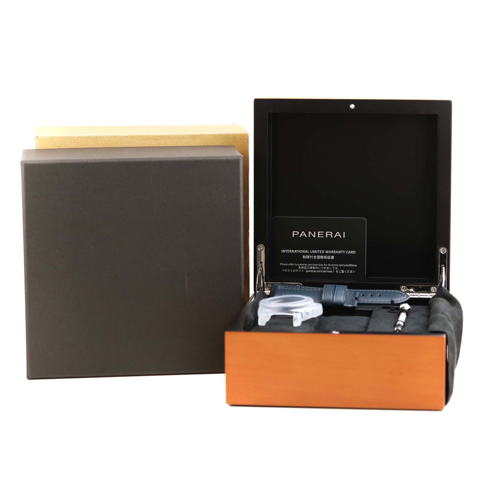 The image shows a Panerai Submersible PAM01232 Men's Titanium Blue Dial PAM01232 Men's Titanium Blue Dial watch box with additional accessories, including straps and tools, viewed from the front.