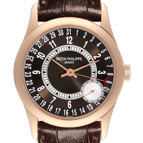 The Patek Philippe Calatrava 6000R-001 Men's Rose Gold Brown Dial 6000R-001 Men's Rose Gold Brown Dial watch is shown from a front angle, displaying its dial, hands, and crown.