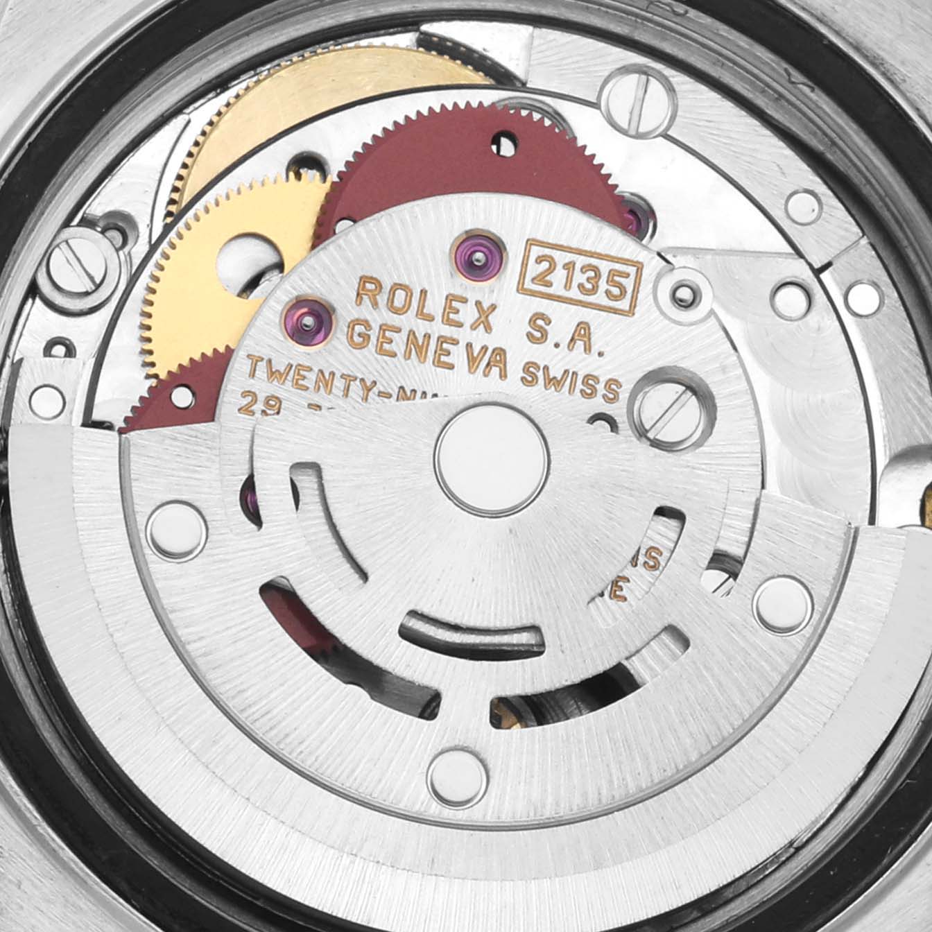 The image shows a close-up of the Rolex Date 69160 Women's Stainless Steel White Dial 69160 Women's Stainless Steel White Dial model's movement, highlighting gears and engravings.