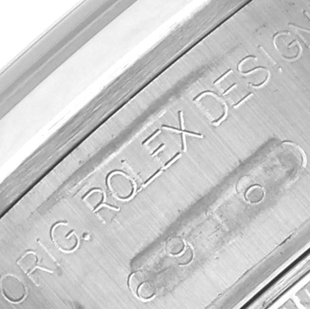 The image shows a close-up of the engraving on the side of a Rolex Date 69160 Women's Stainless Steel White Dial 69160 Women's Stainless Steel White Dial watch case.